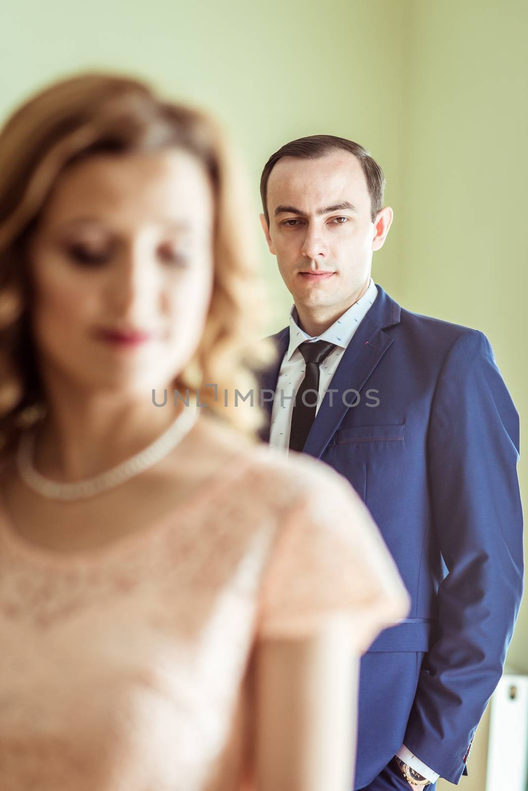 Close up portrait of happy husband and wife after the ceremony in a registry office in Lviv, Ukraine