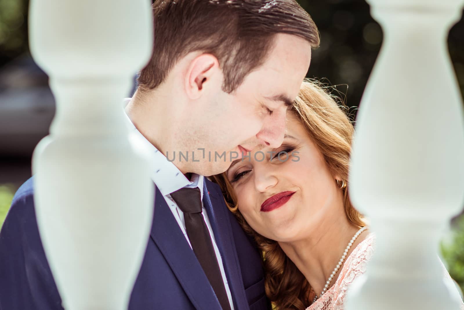 Portrait of happy man and woman at the registry office after the ceremony in Lviv, Ukraine