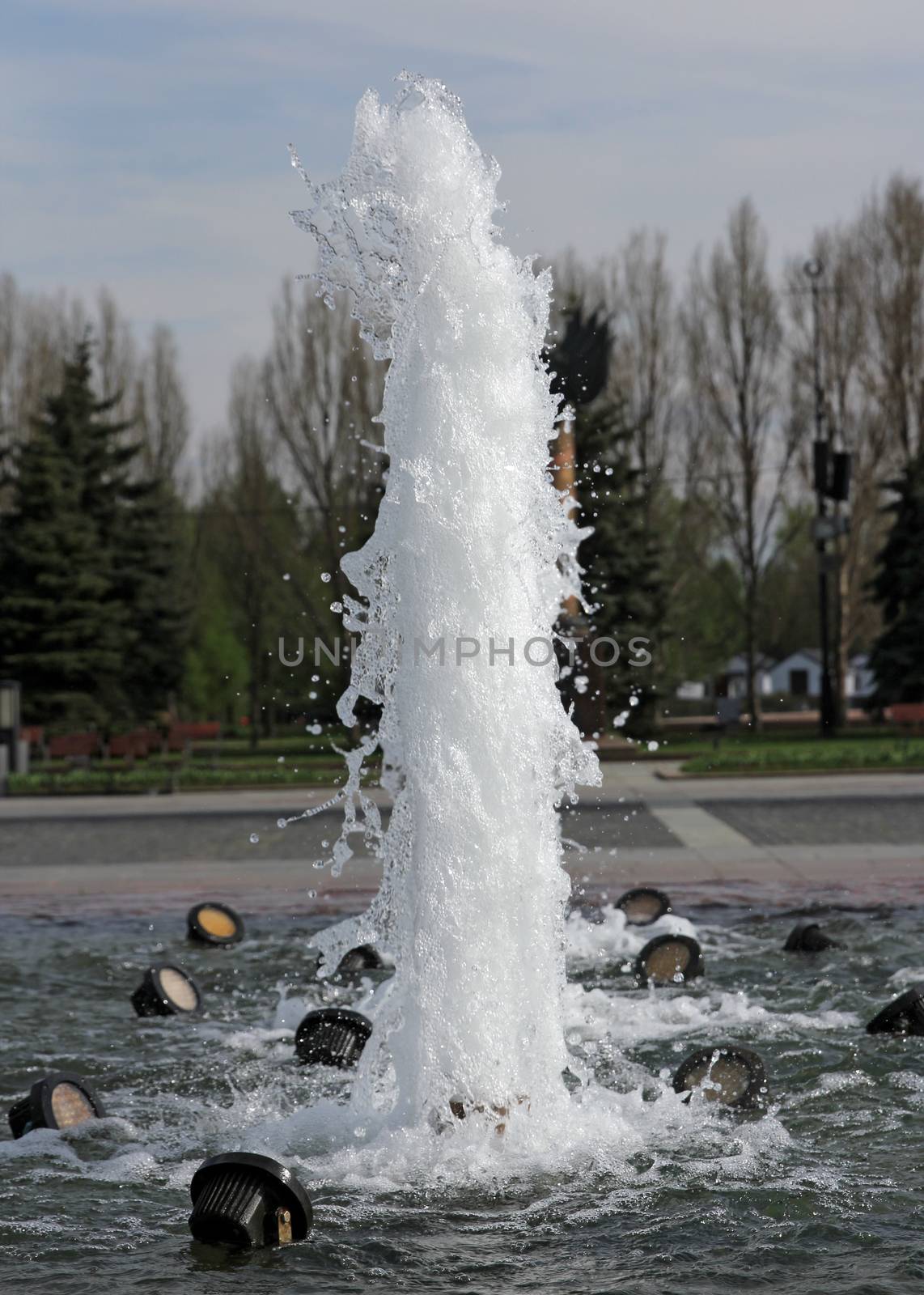 The gush of water of a fountain.