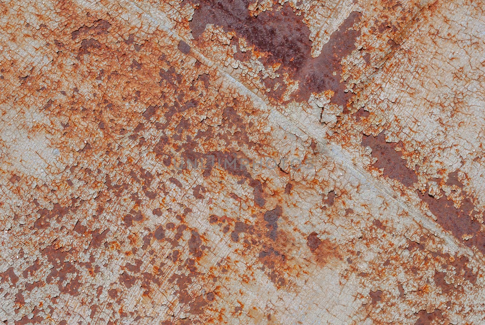 surface of rusty iron with remnants of old paint, chipped paint, texture background by uvisni