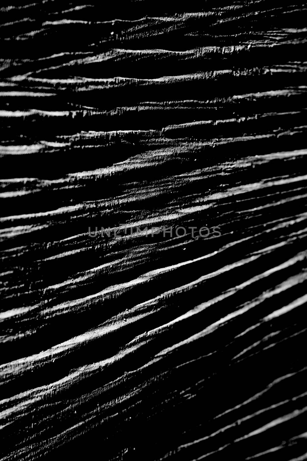 Wooden texture in black and white with light and shadows effects