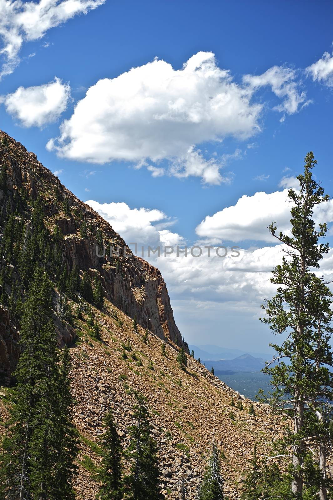 Colorado Springs - Pikes Peak Highway. Cloudy Blue Sky and Rocky Mountains.