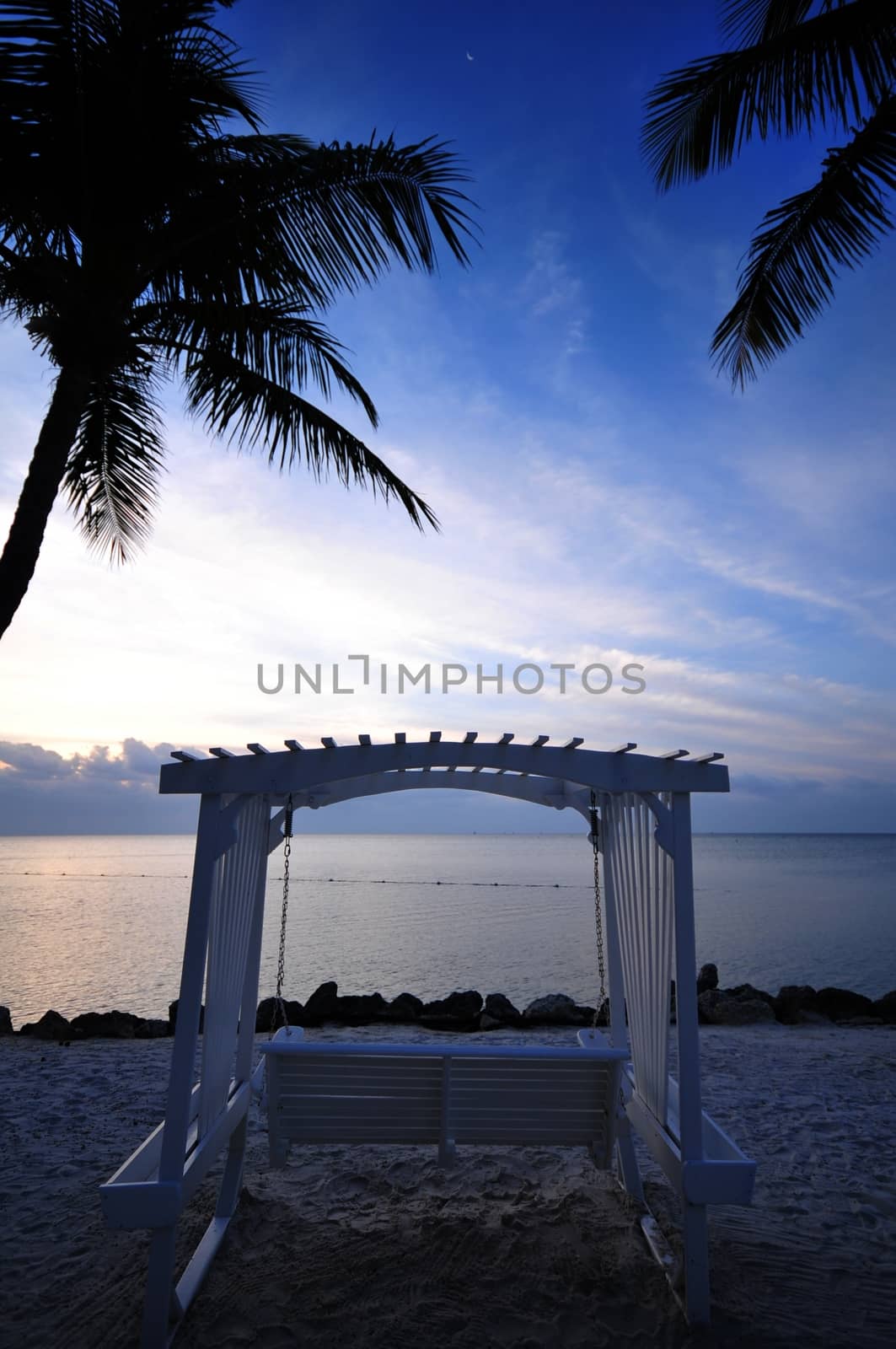 Beach Bench and Ocean Front Sunrise. Florida Keys USA. Vertical Photo