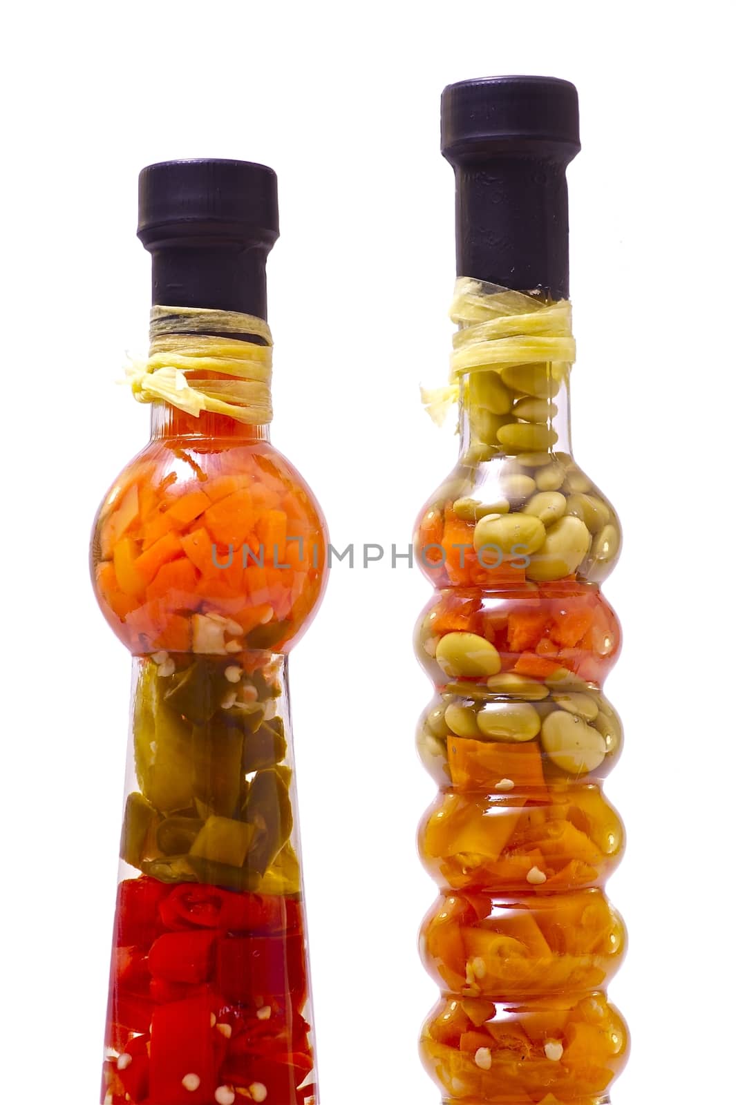 Exotic Spices in Exotic Clear Glass Bottles. Clipped Photo - Solid White Background