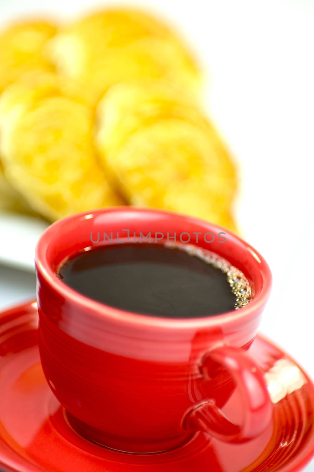 Morning Breakfast.  Hot Coffee, Red Cup and Fresh Croissants. White Background. Elegant Composition.