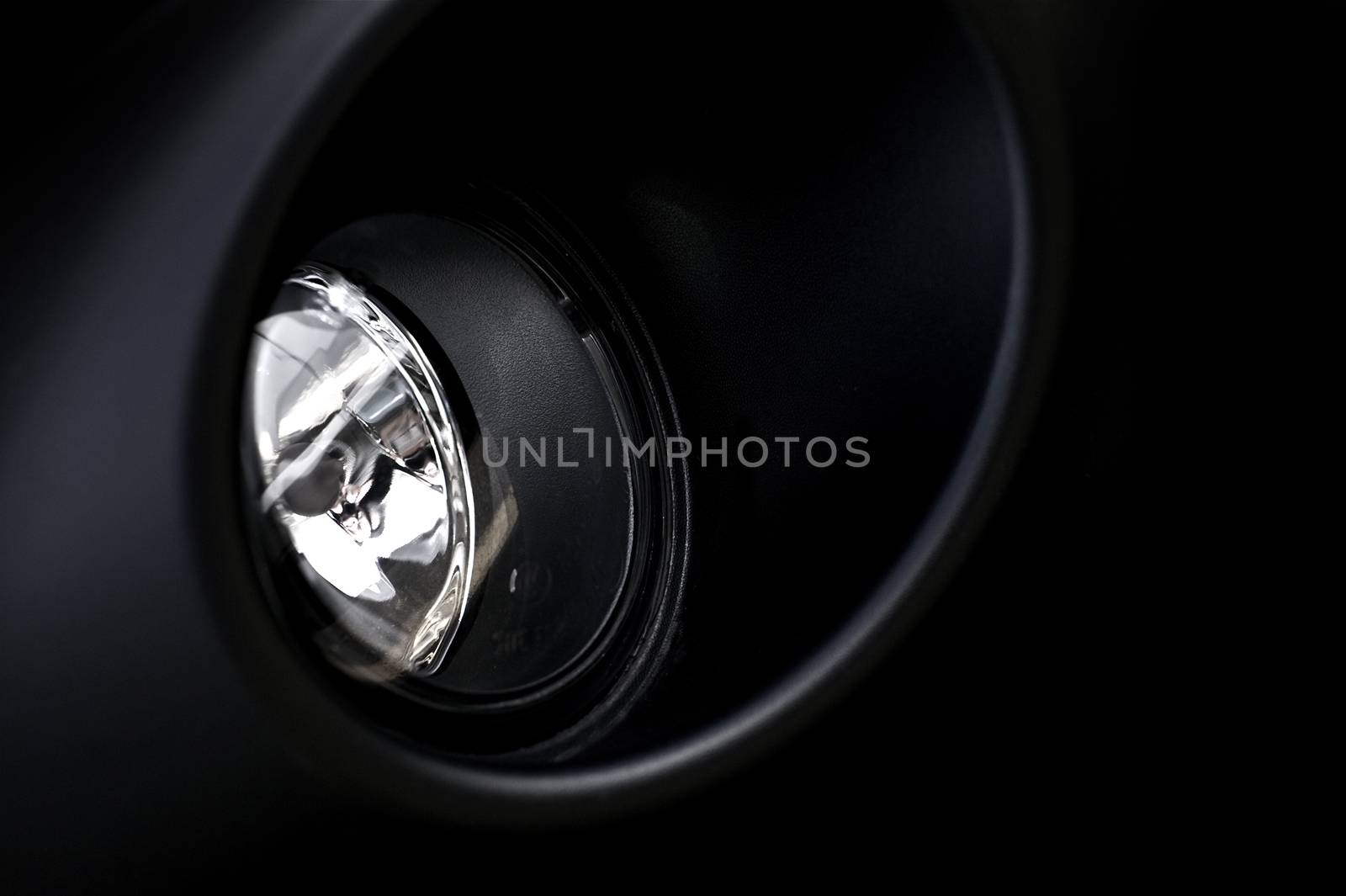 Bumper Halogen Modern Vehicle Lighting. Black Bumper / Black Vehicle Body.  Vehicle Fog Light