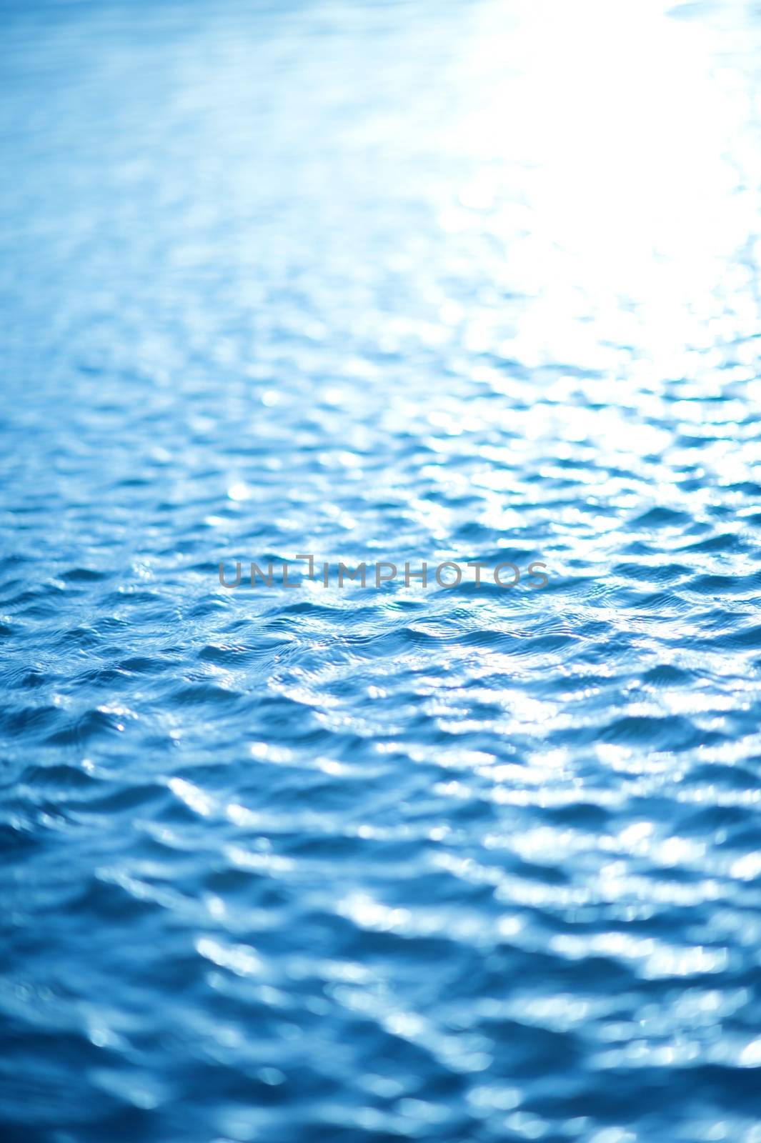 Water Waves Background - Blue Tones Water Surface. Vertical Photography.