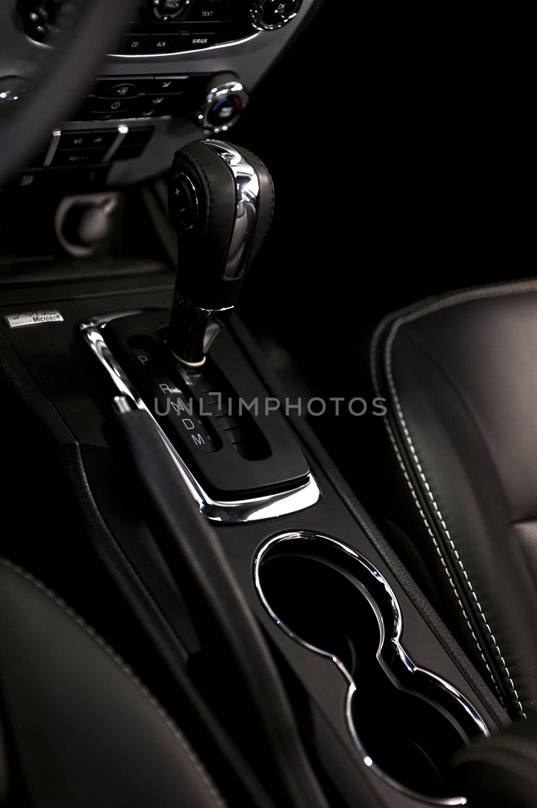 Modern Interior Car Design. Black Leather Vehicle Interior with Chrome Elements. Vertical Photo.