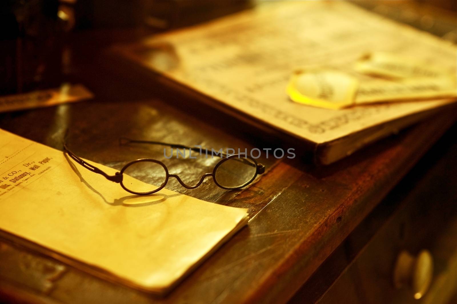 Vintage Desk - Old Wood Desk with Books and Glasses. Antique Photo Collection.