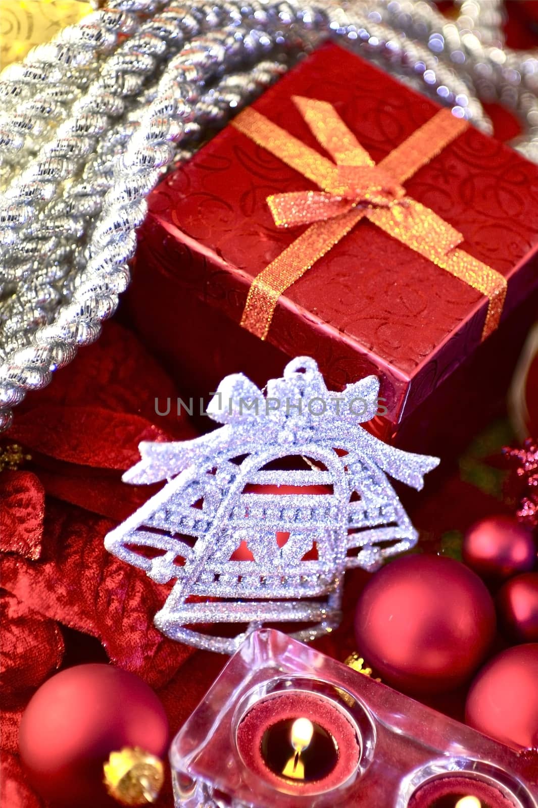 Holiday Ornaments. Red Present Box, Silver Bell Ornament and Some Candles. Holidays Photo Collection