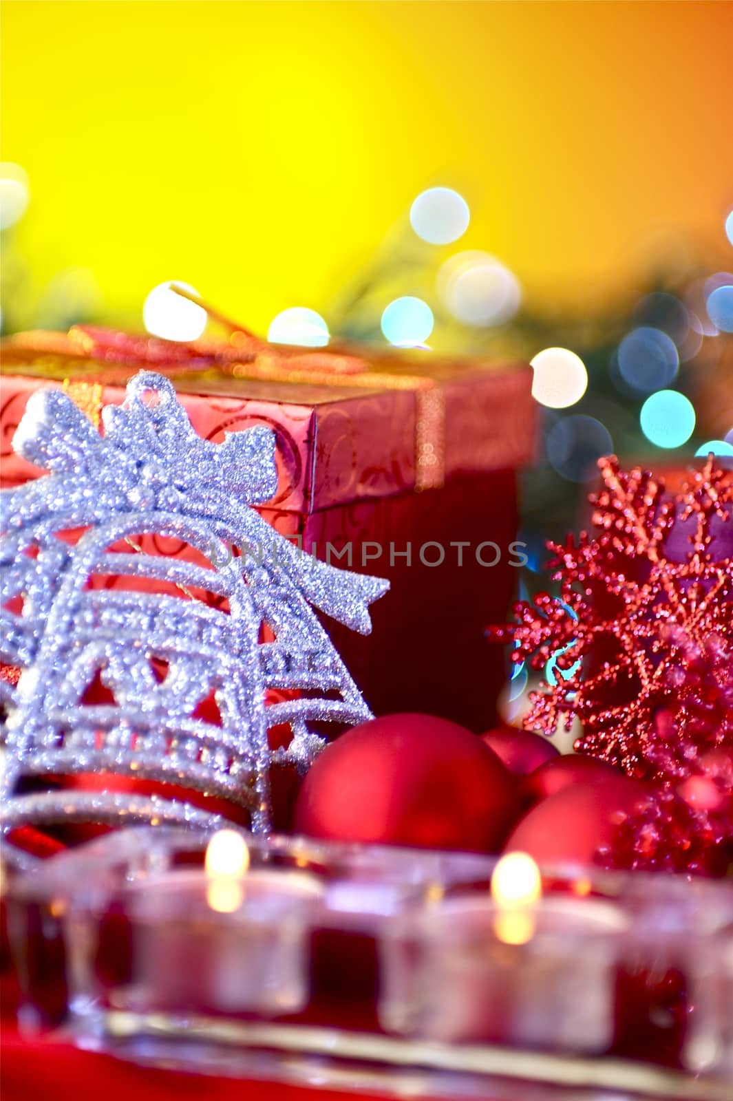 Christmas Composition. Christmas Ornaments and Red Candles. Yellow Background
