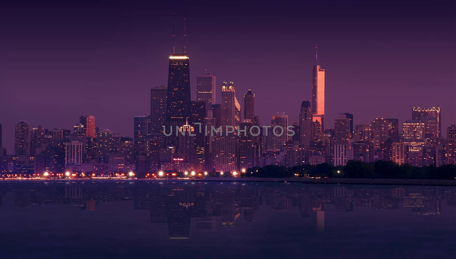 Skyline Chicago During Sunset - Early Evening. Panoramic Photography. Skyline Lake Mirror Has Been Added Digitally. Windy City and Lake Michigan. Horizontal Photo