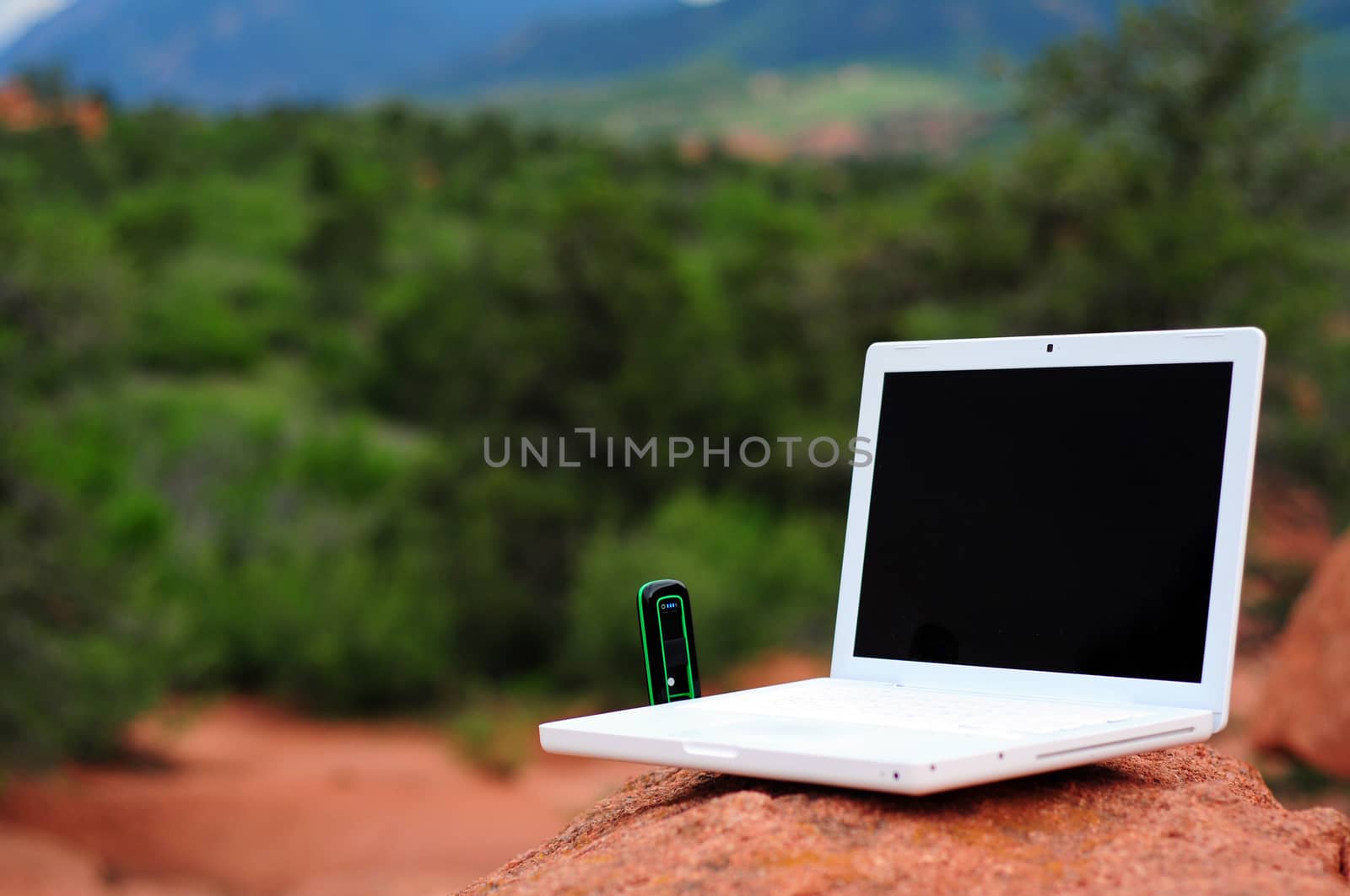 Broadband Internet. Outdoor Internet Surfing. Laptop on the Rock.