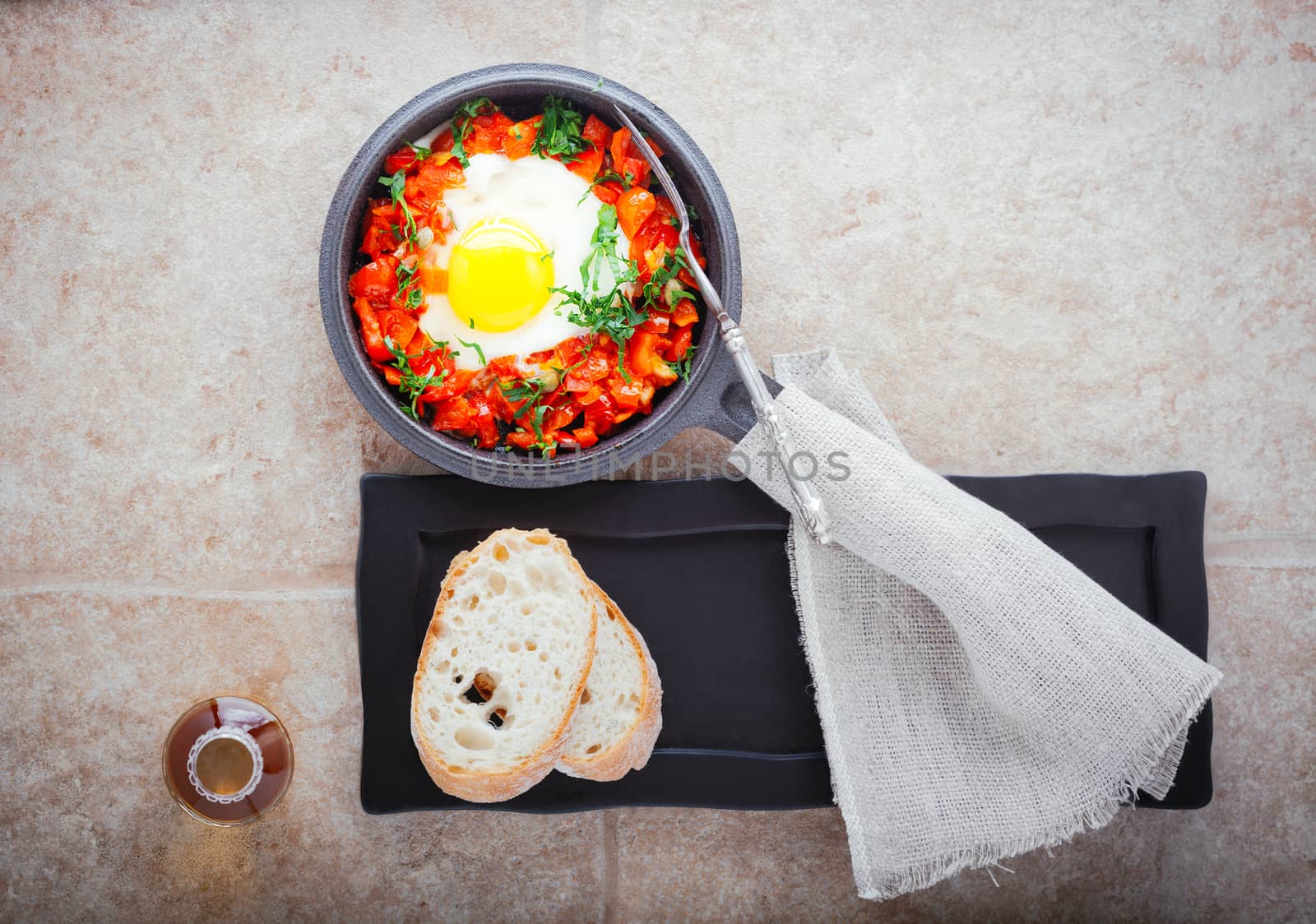 Traditional middle eastern dish of shakshuka in a pan . by supercat67