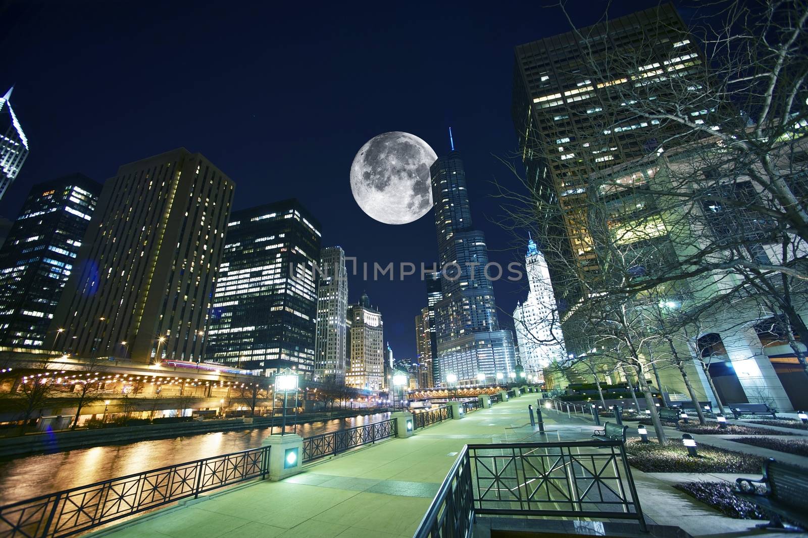 Chicago USA. Chicago at Night. Shot Taken from Chicago Famous Riverwalk. Large Moon on the Sky.