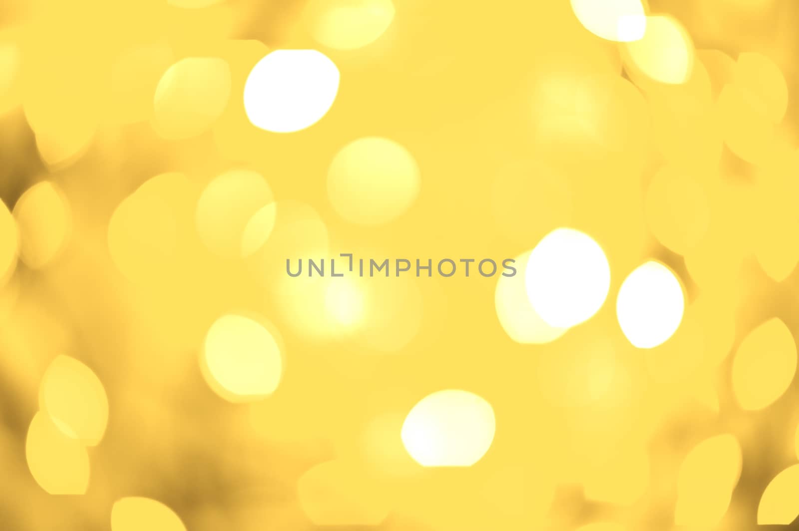 Golden Lights Bokeh Background. Out of Focus Golden Lights. Cool Golden Bokeh Background.Perfect for Christmas Related Artwork. Holidays Photo Collection.