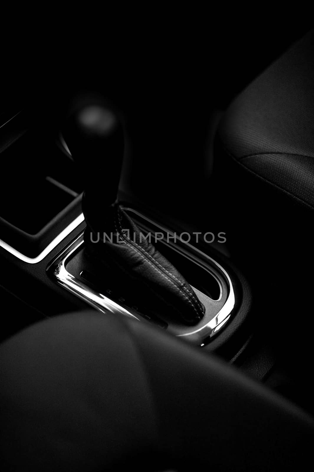 Stick-Shift for Automatic Vehicle Transmission. Black Interior with Seats and Stick-Shift in the Middle. Vehicle Interiors Photo Collection.