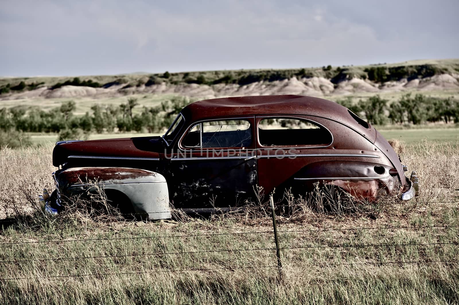 Clunker on Prairie near Pine Ridge Indian Reservation in South Dakota. Abandoned Car in South Dakota. 