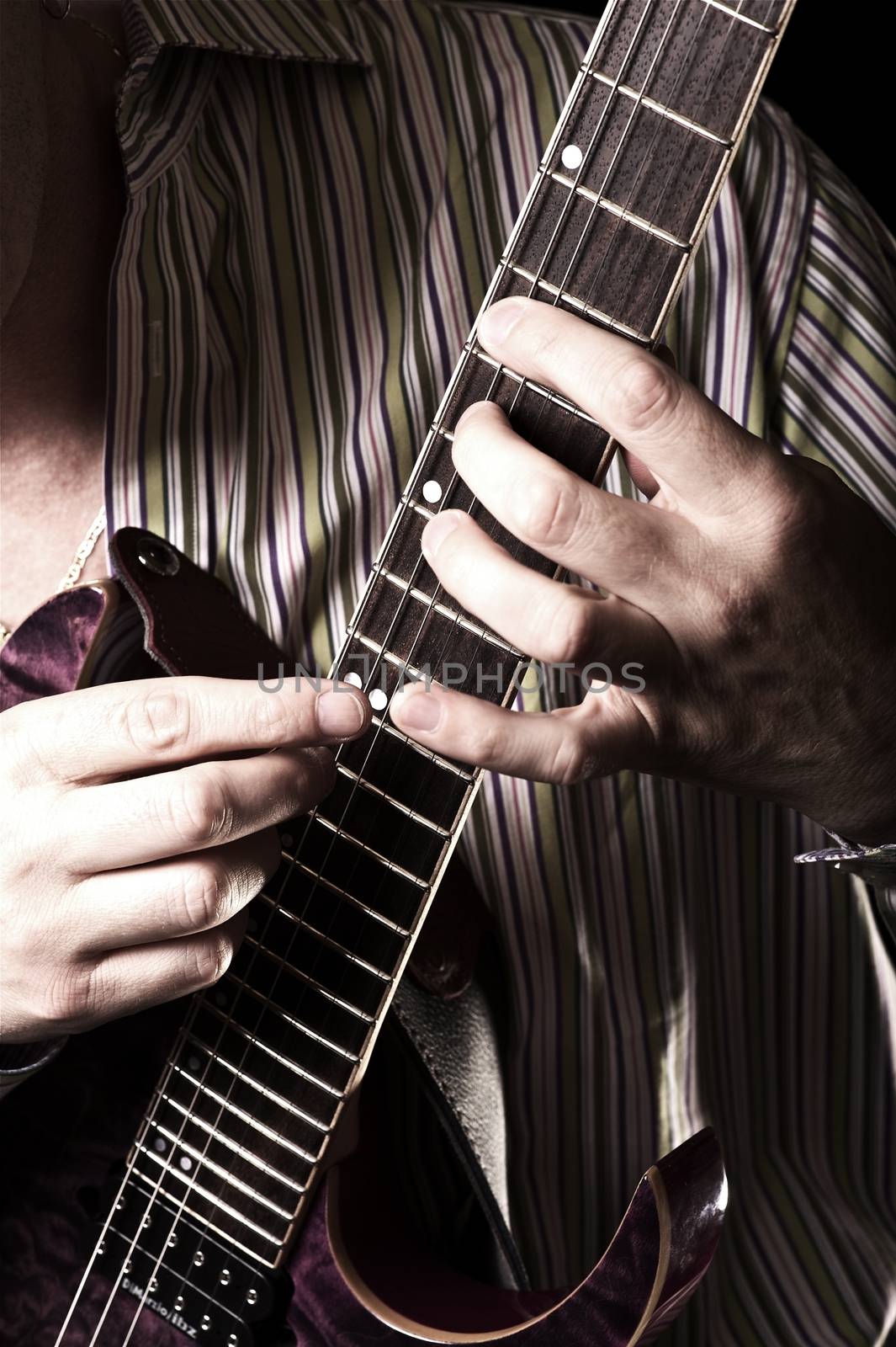 Guitar Player. Male Playing Guitar. Vertical Photography. Music Theme