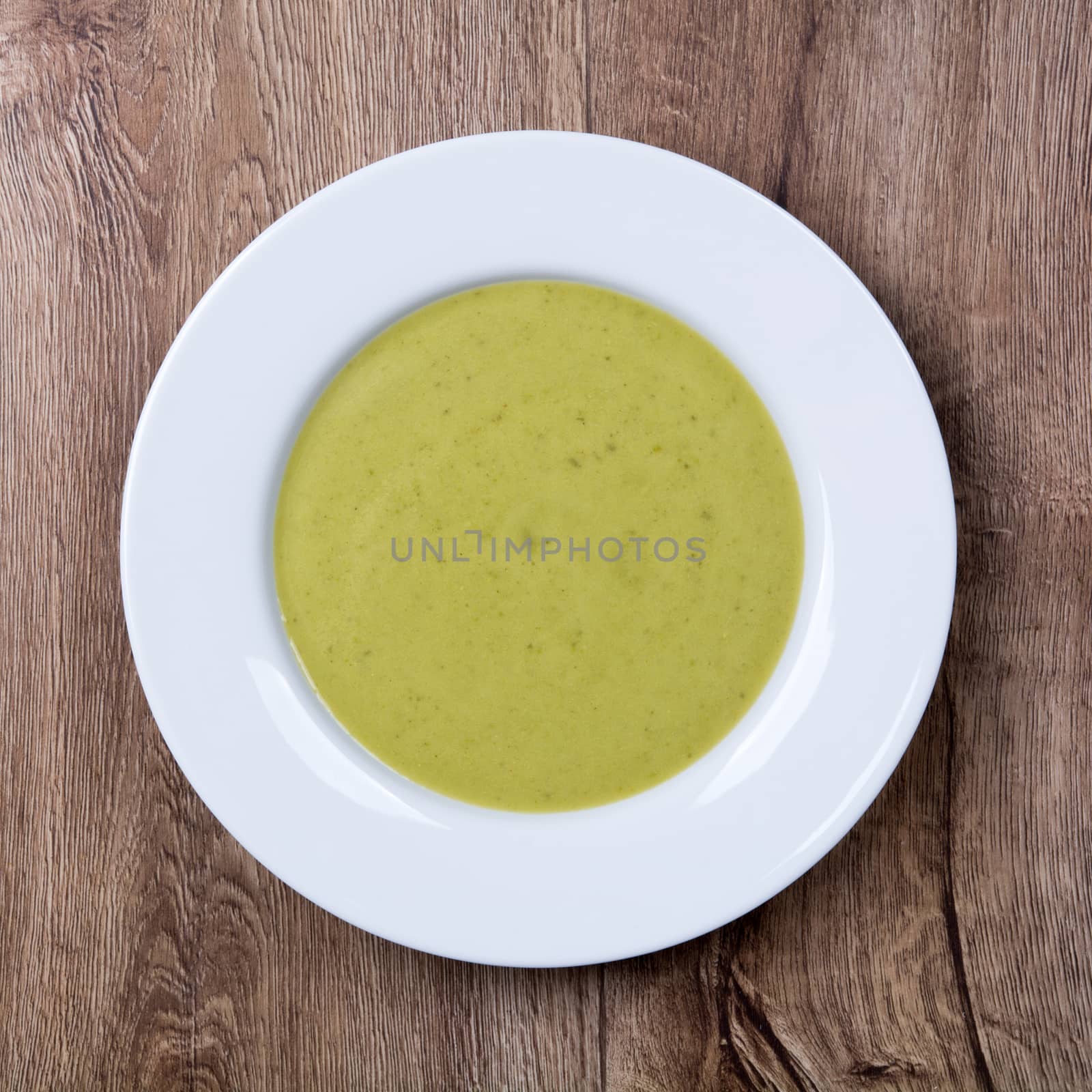 Vegetarian vegetable soup on a wooden table