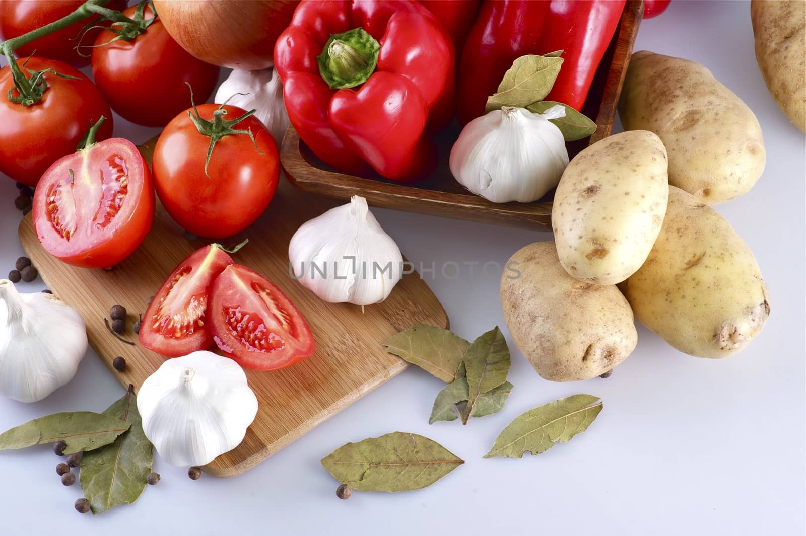 Dinner Ingredients. Many Vegetables Preparation for Healthy Dinner. Tomatoes, Potatoes, Red Paprikas, Garlic and Some Spices. Horizontal Photography