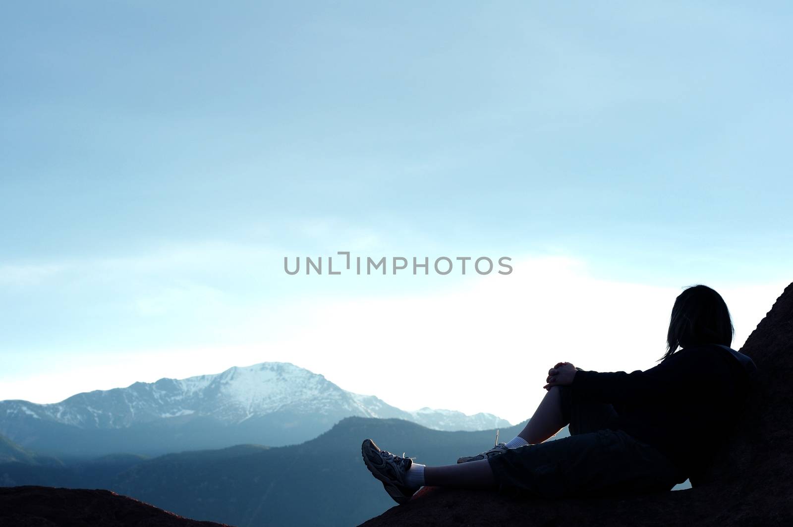 Female on the Rocks - Rocky Mountains. Great Copy Space - Colorado Theme