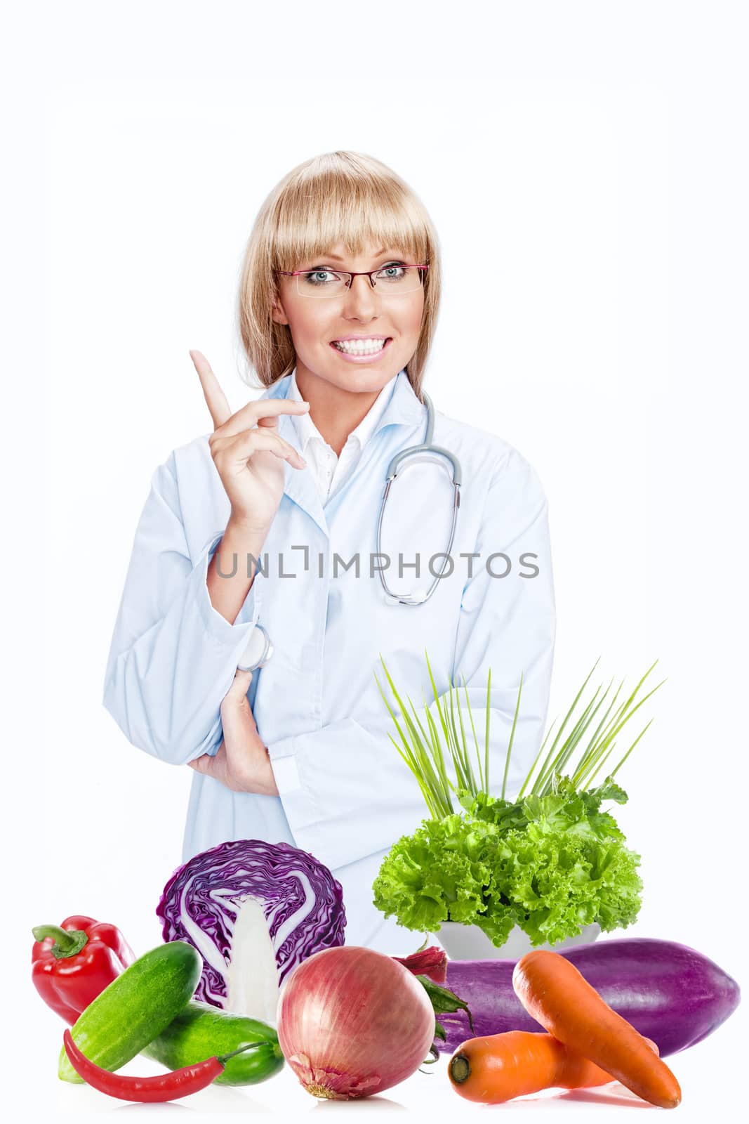 Portrait of nice doctor gesturing  and smiling on white  back