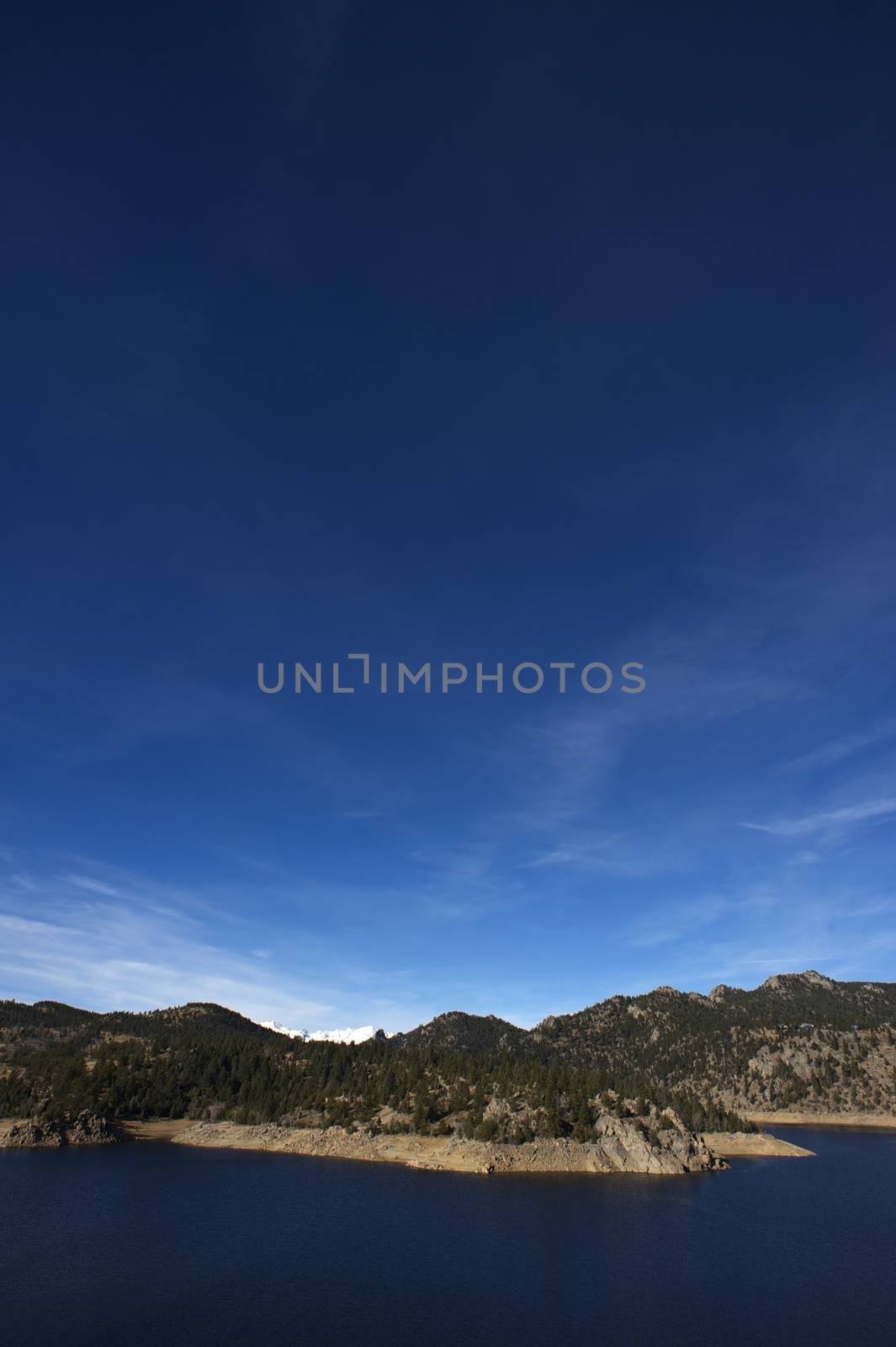 Colorado Clear Sky, Water Reservoir and Mountains. Gross Reservoir - Boulder County, Colorado, USA. Vertical Photography