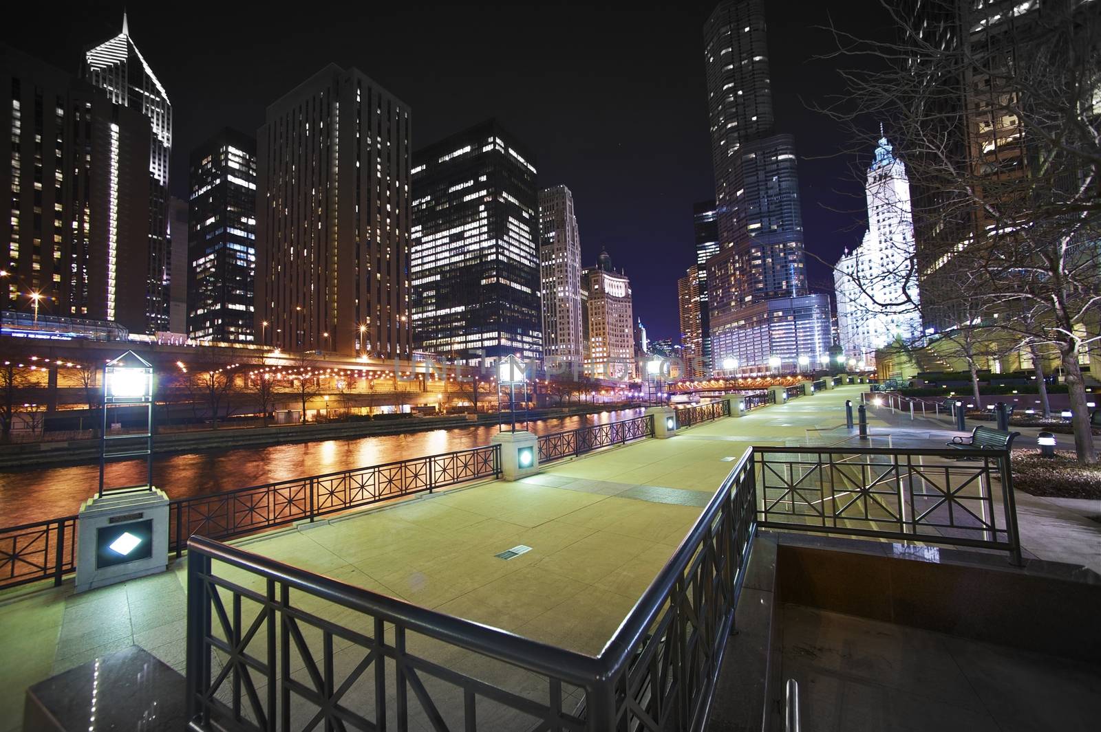 Riverwalk Downtown Chicago, Illinois USA. Super Wide Angle NIght Time Photography of Chicago River, Riverwalk and Skyscrapers.