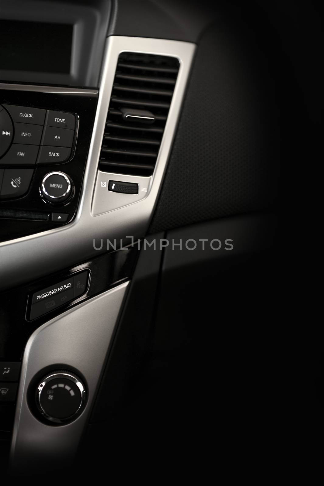 Modern Car Dashboard Vertical Studio Photography. Dark Vehicle Interior with Silver Elements.