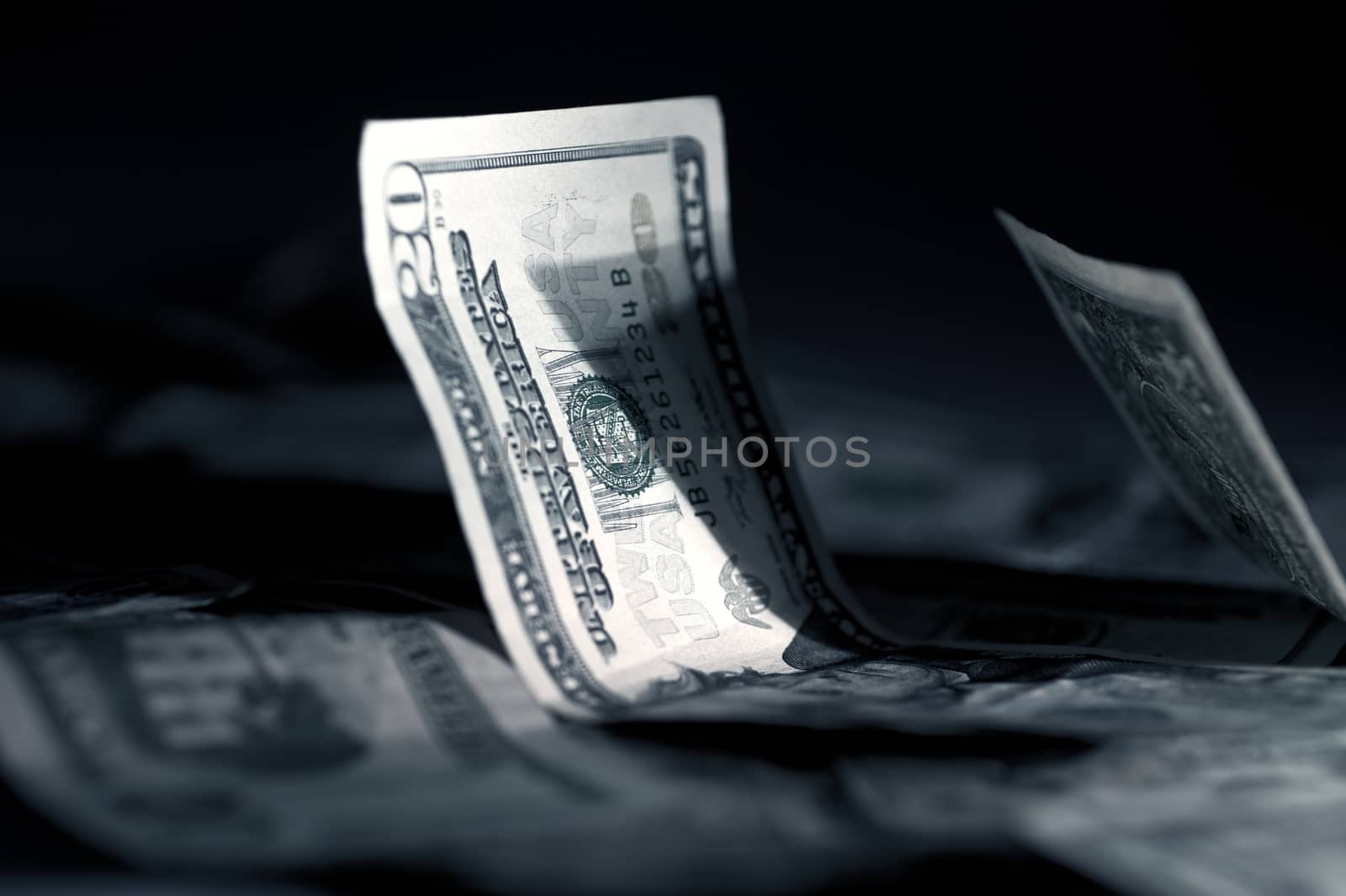 American Dollars in Dark Studio Photography. Business / Money Theme.
