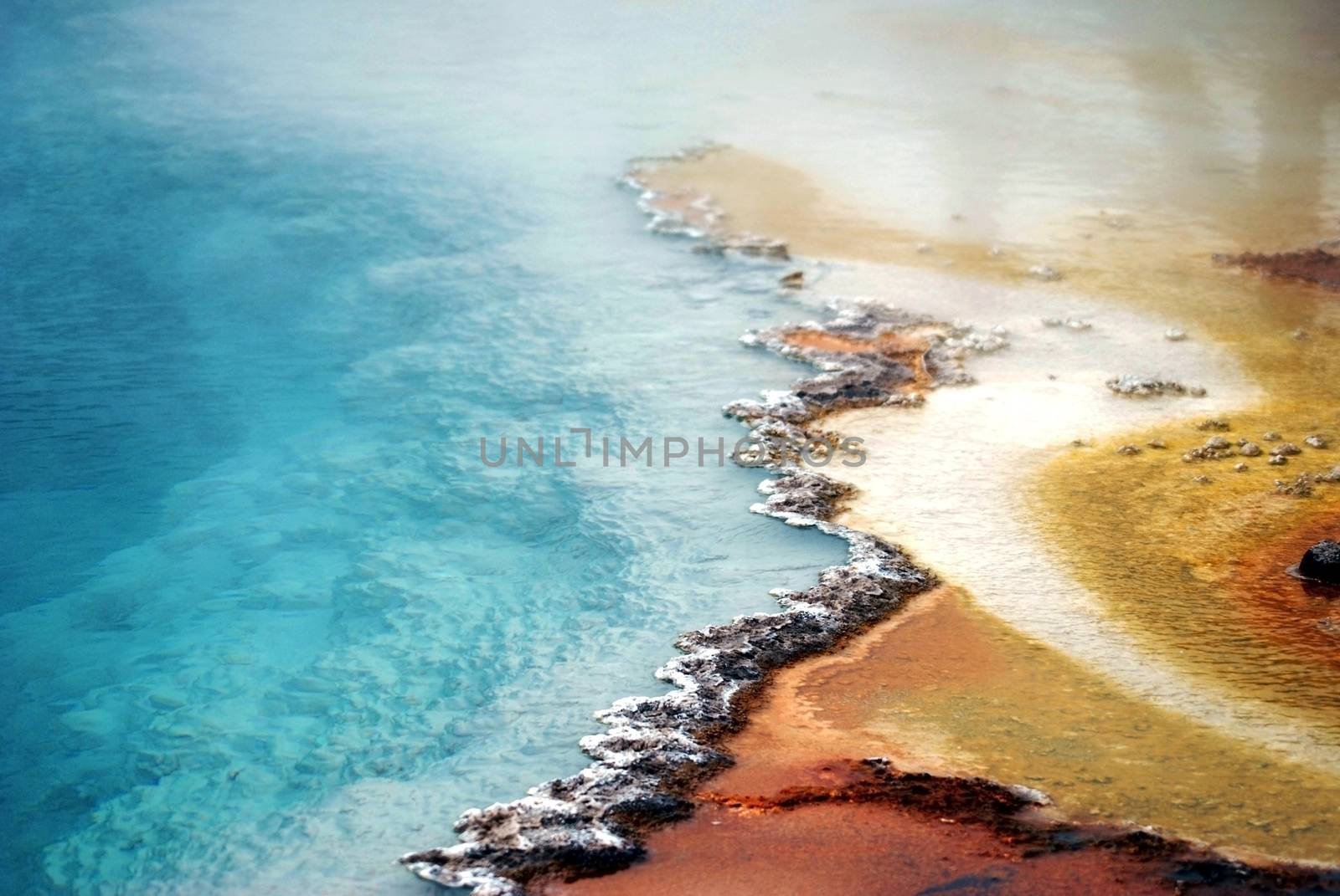 American National Parks: Yellowstone Geyser, Crystal Clear Toxic Water of Geyser. Wyoming, USA