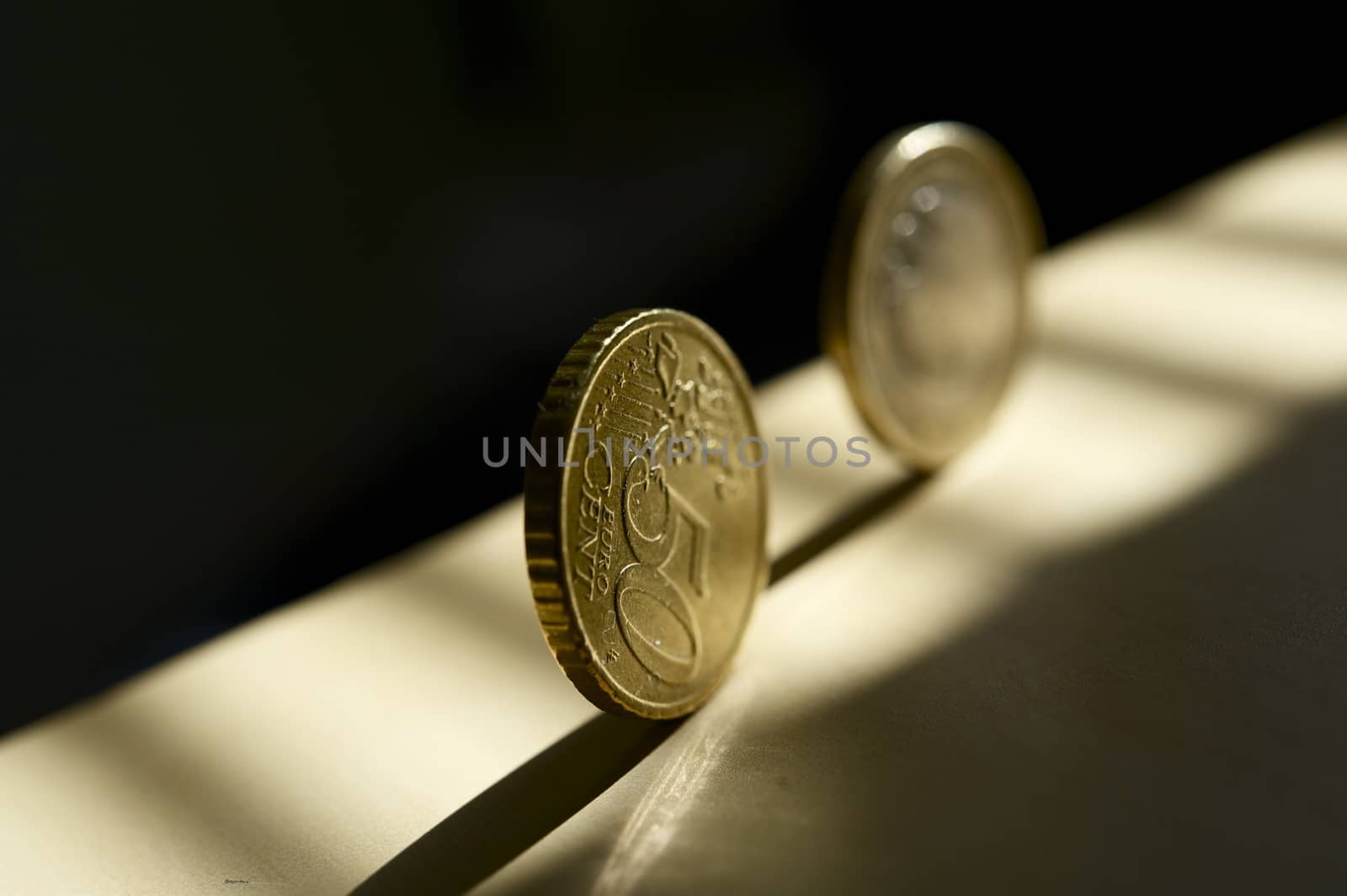 Rolling Euro Money - Rolling Euro Coins in the Sunlight. European Union Business Theme. Horizontal Photography