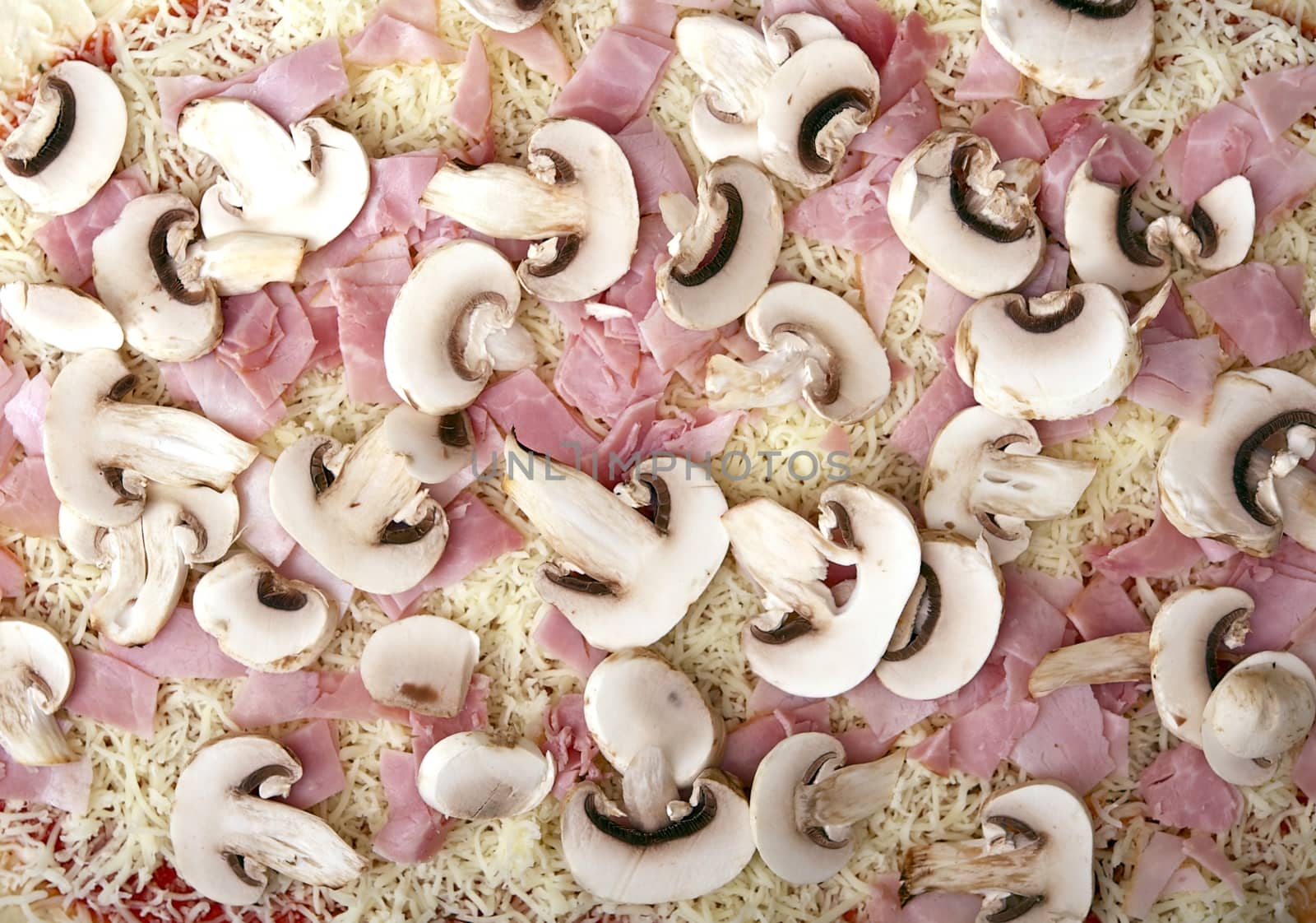 Raw Pizza Ready for Baking. Raw Pizza Ingredients Like Cheese, Ham and Mushrooms. Horizontal Closeup Photo.