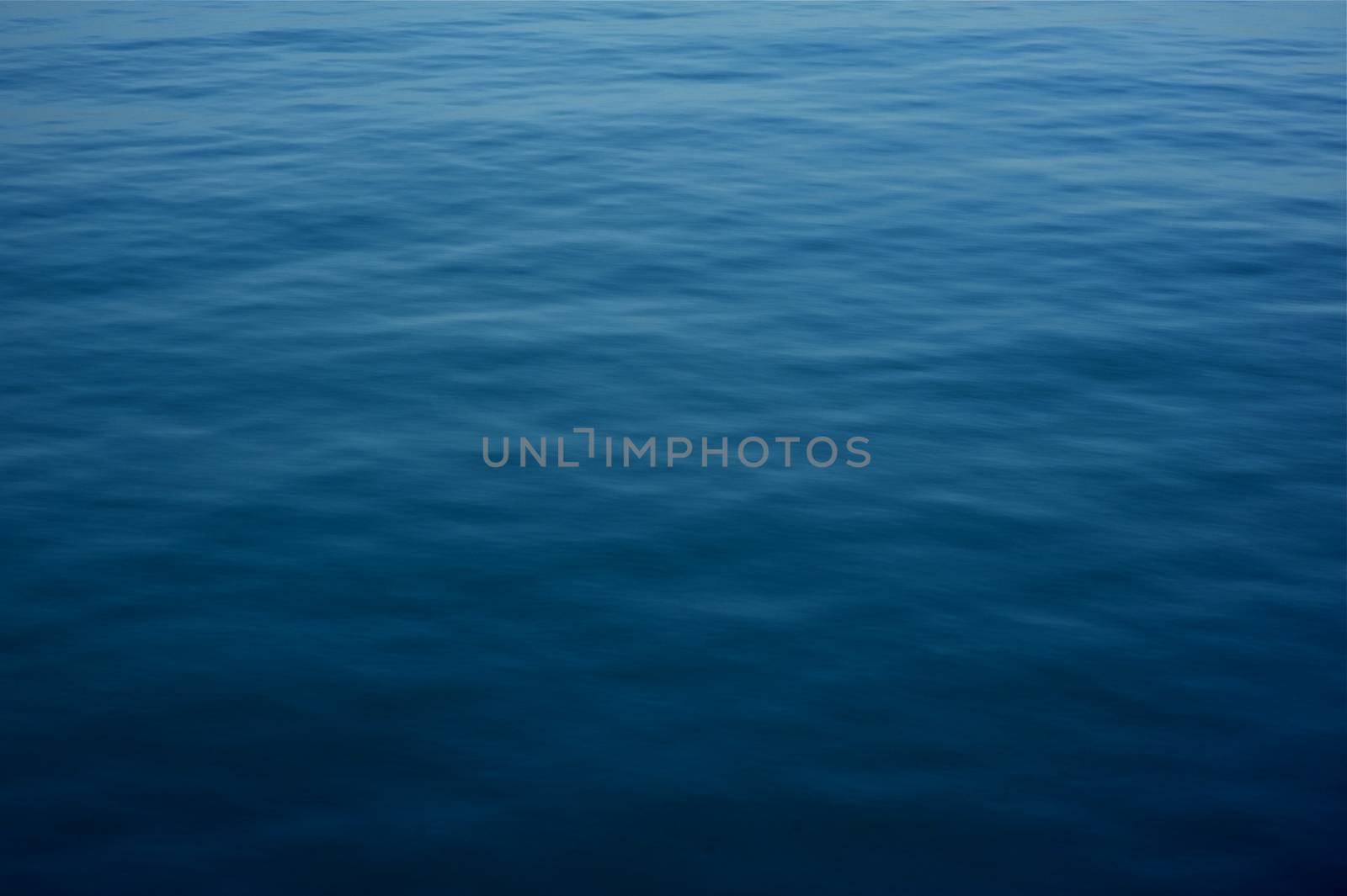 Deep Blue Water Surface Background. Horizontal Natural Water Surface Photography.