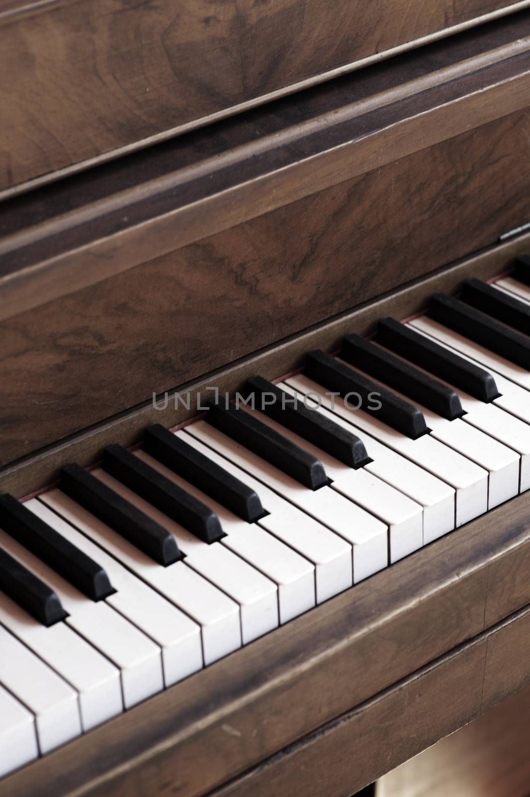 Vintage Piano Closeup Vertical Photo. Old Piano in Dust.