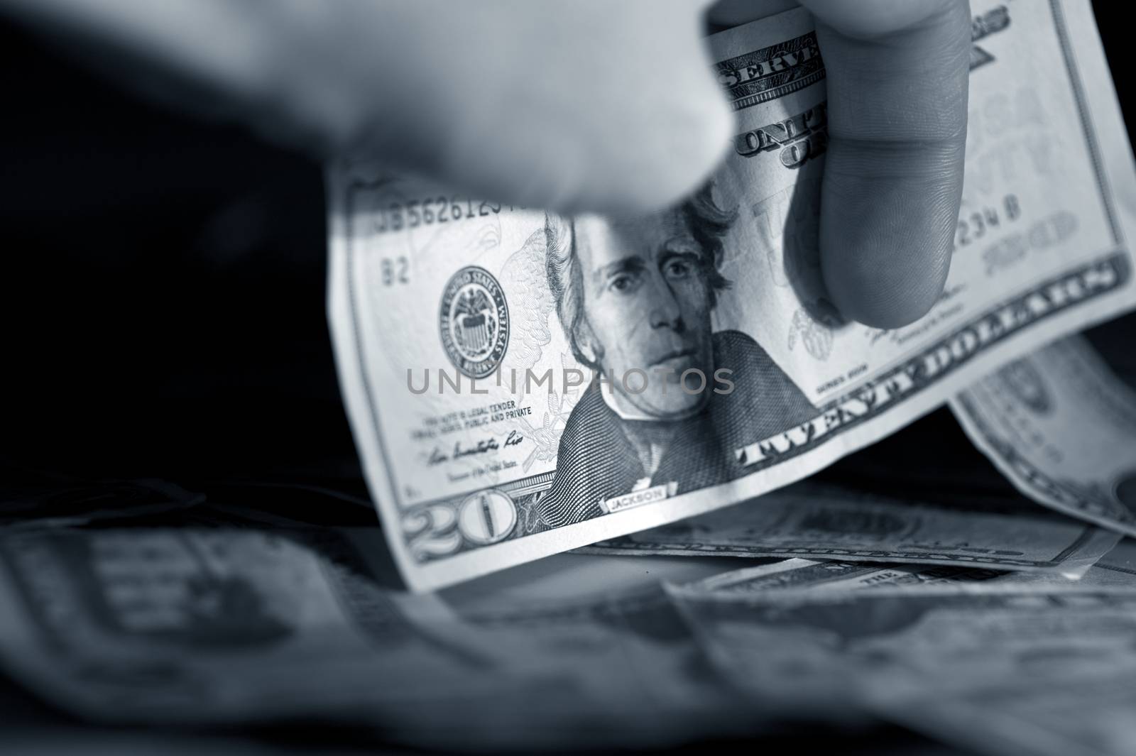 Money in Hand - Twenty American Dollars in Men Hand. Dark Closeup Photo.