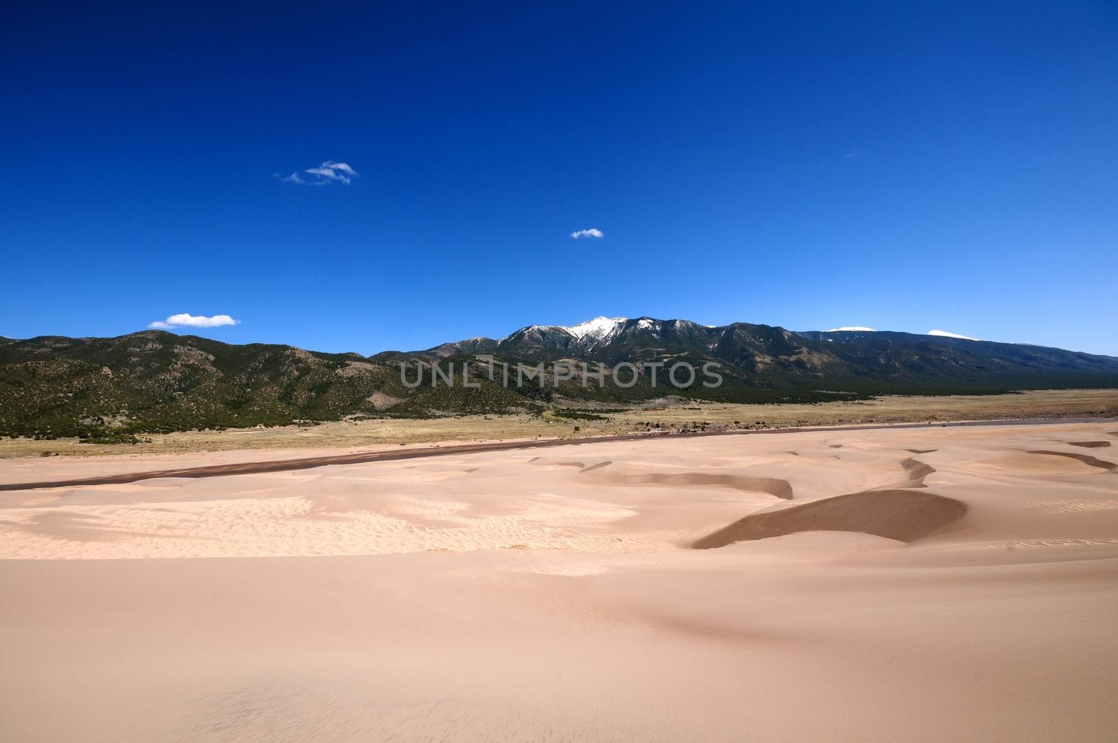 Dunes and Mountains. Great Sand Dunes National Park Colorado USA and Rocky Mountains