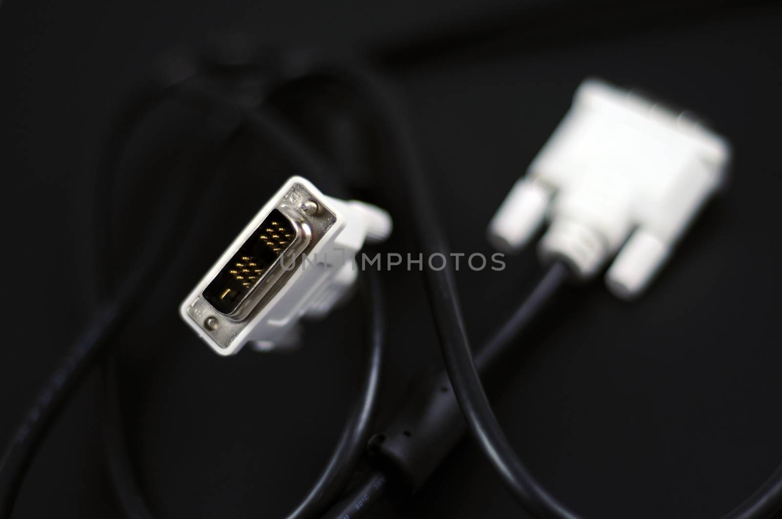 White DVI-D Dual Link Digital Monitor Cable on Solid Black Background. Technology Photo Collection.