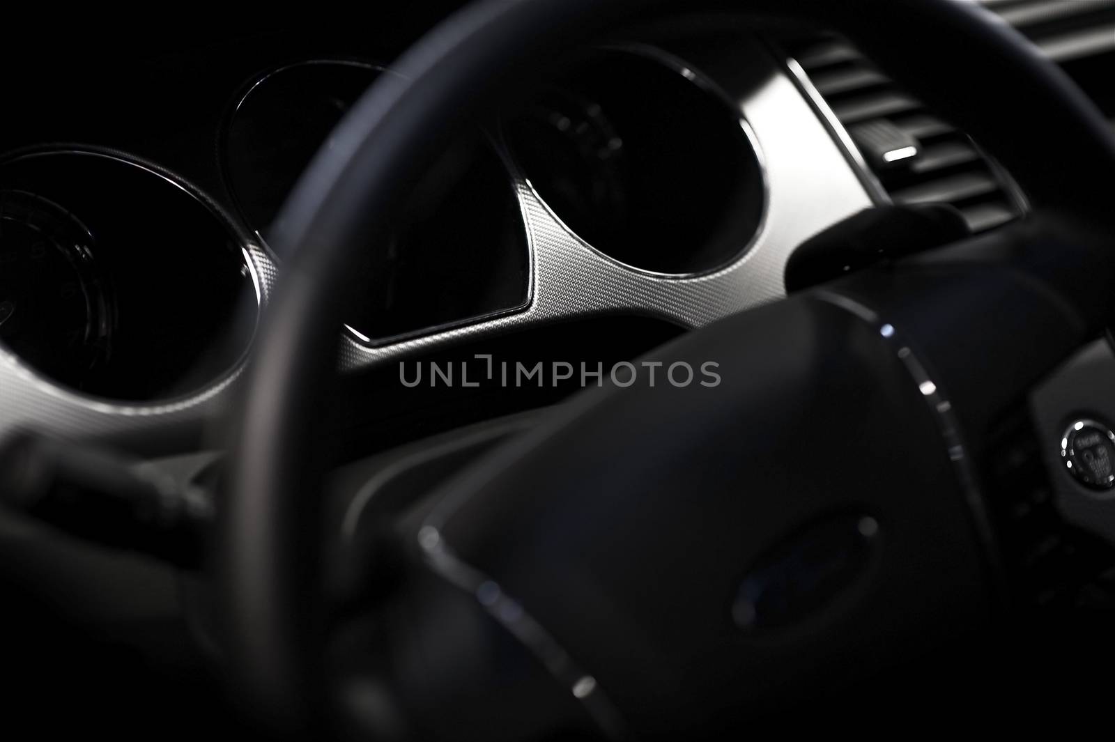 Car Steering Wheel and Dark Black Interior - Vehicle Dashboard. Closeup Photography