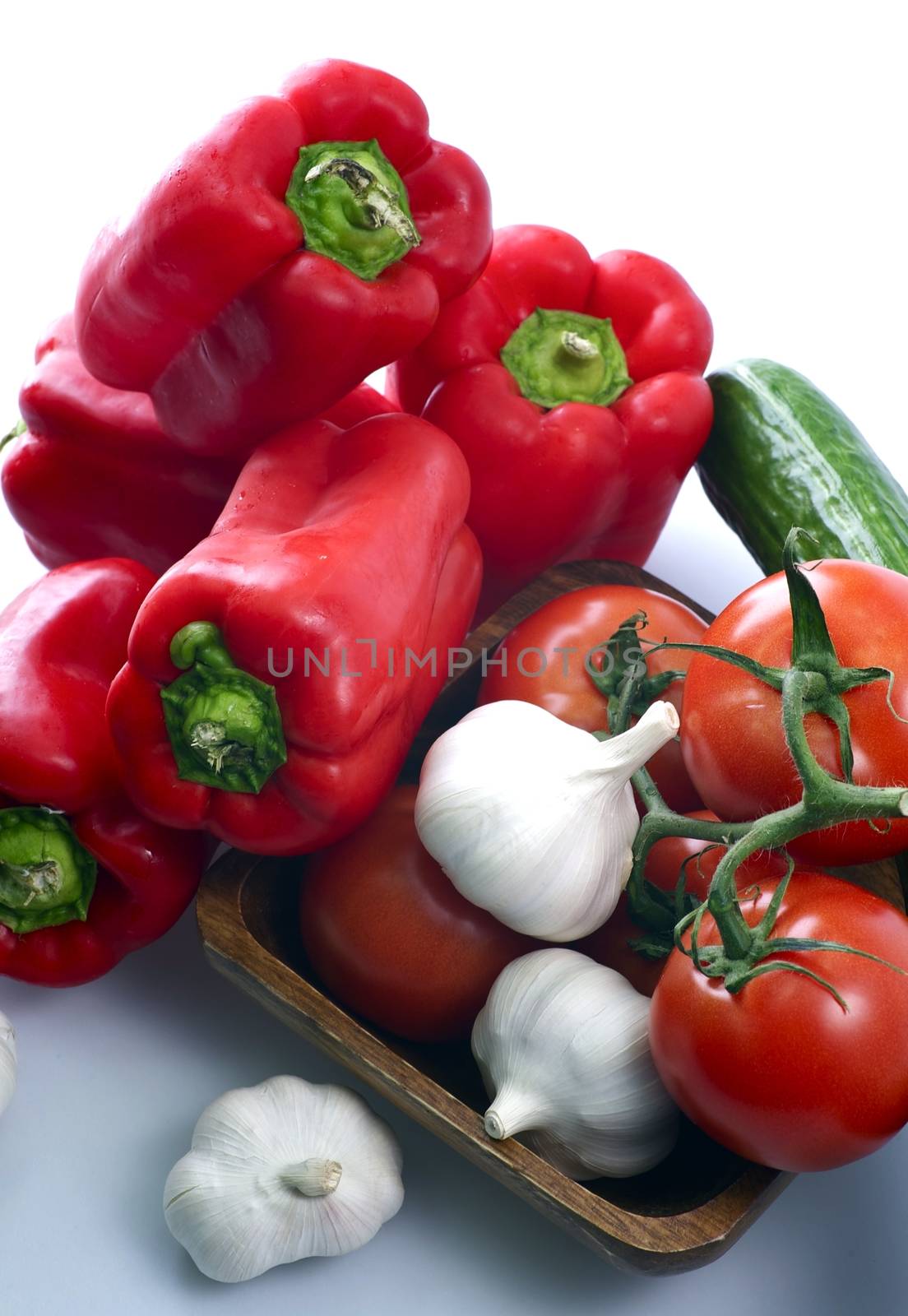 Vegetable Diet. Red Paprikas, Tomatoes, Garlic and Fresh Cucumbers Vegetables Studio Photo.