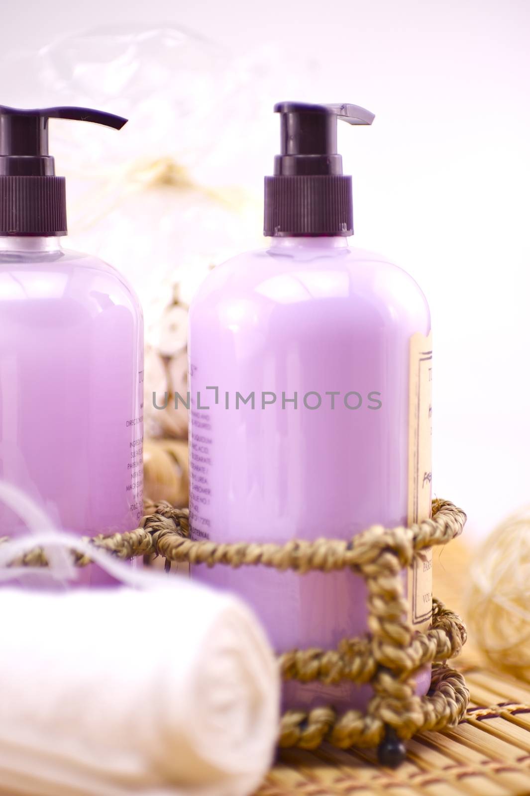 Pink Hand Wash. Two Pinky Soap Bottles and White Towels. Bath Photo Theme.