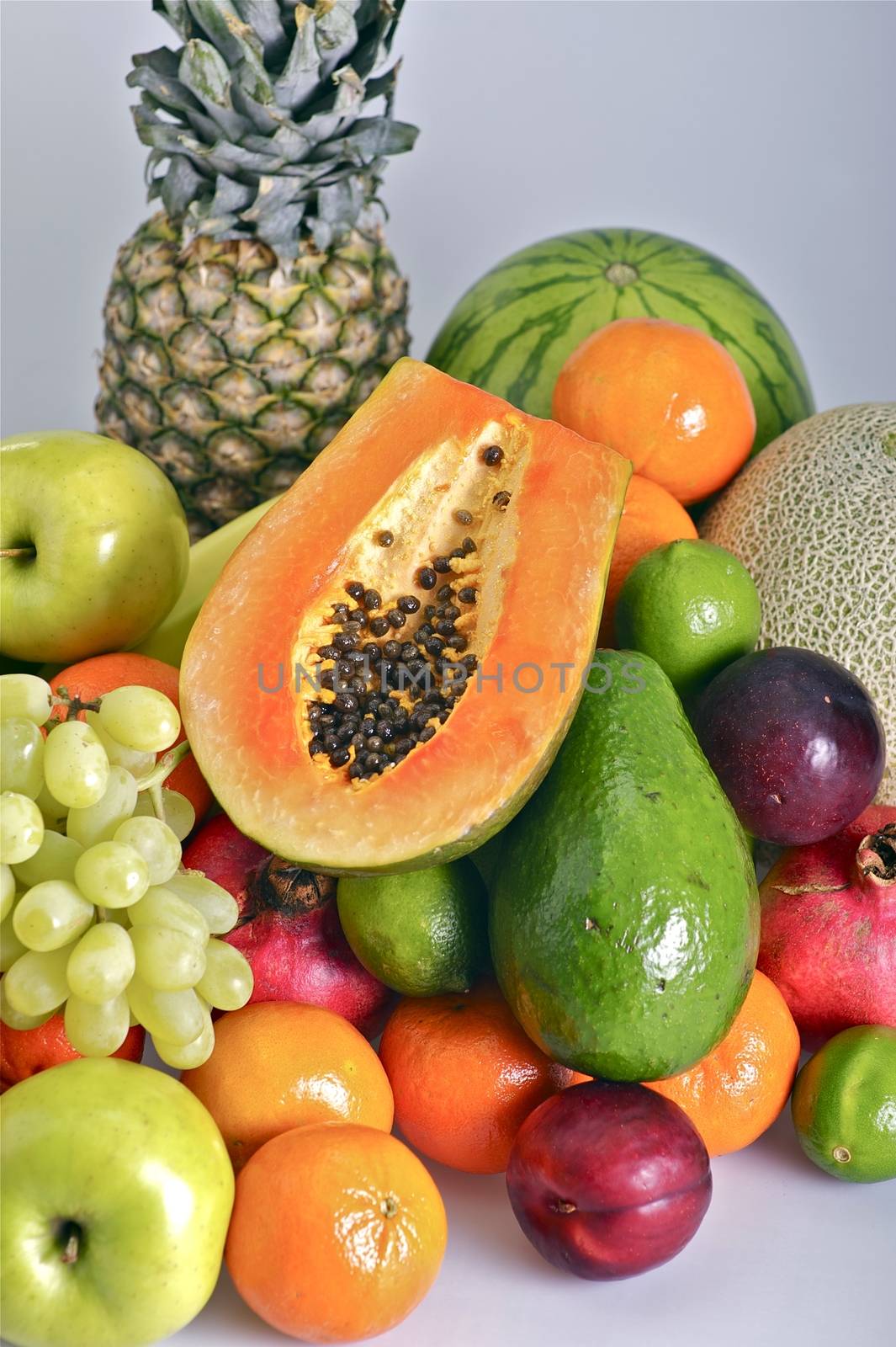 Fruits Pile. Vertical Photo of Many Types of Fruits Like Pineapple, Papaya, Grapes, Apples, Plums and More. Fruits Photo Collection.