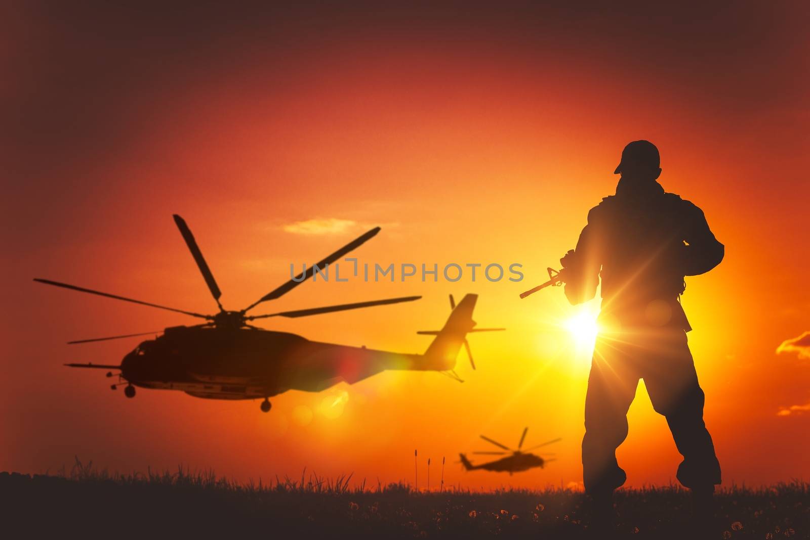 Military Mission at Sunset. Marines Helicopters Air Mission. Soldier with Assault Rifle Cover the Area.