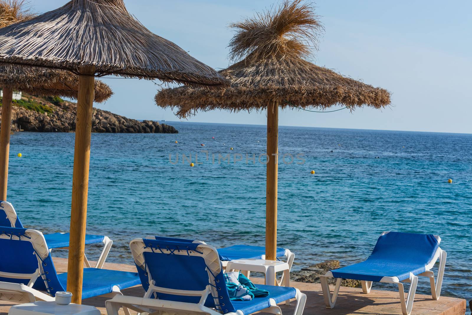 Blue sea, beach with umbrella on Mallorca. by JFsPic