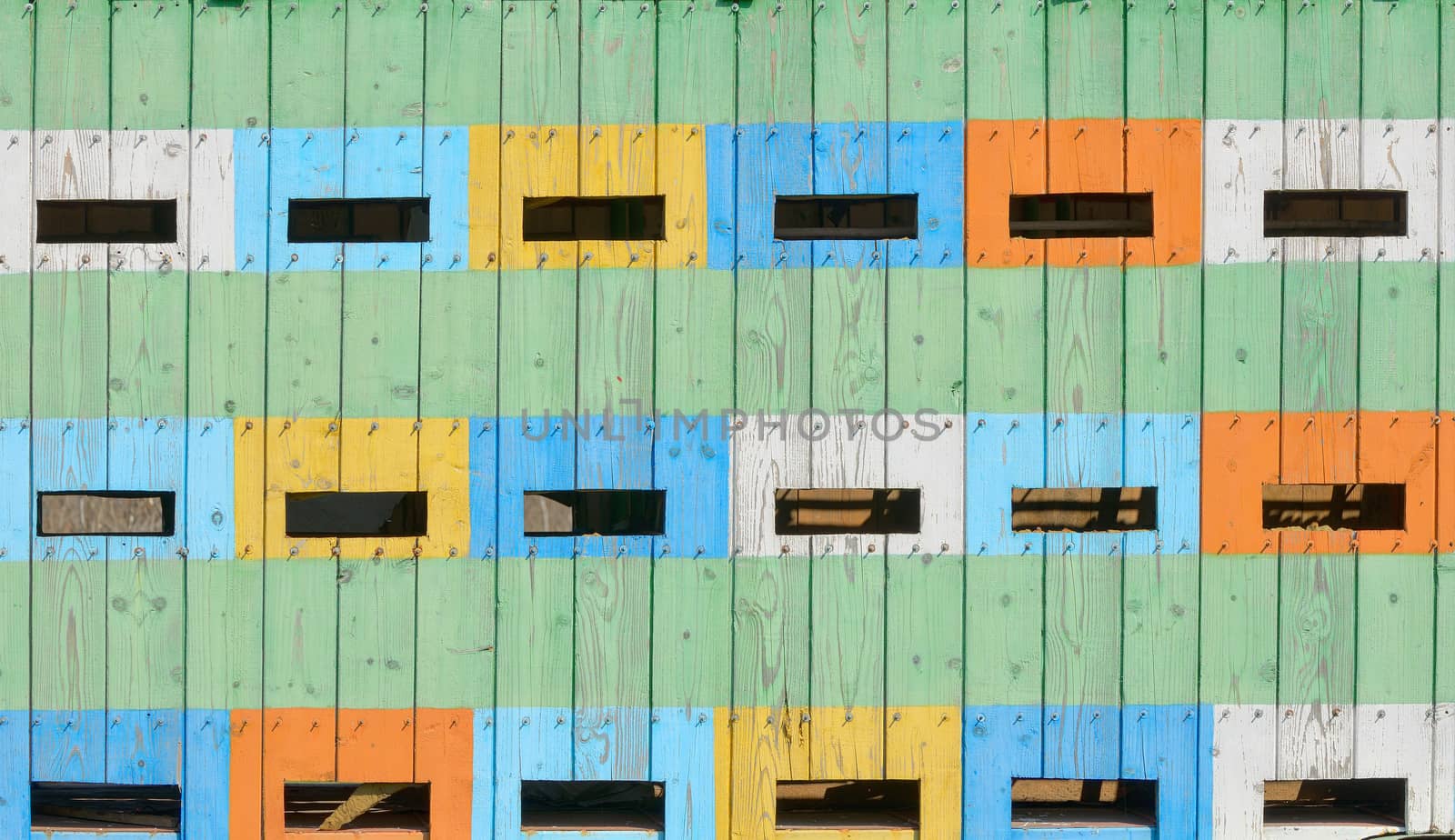 Abstract coloured beehives in spring time