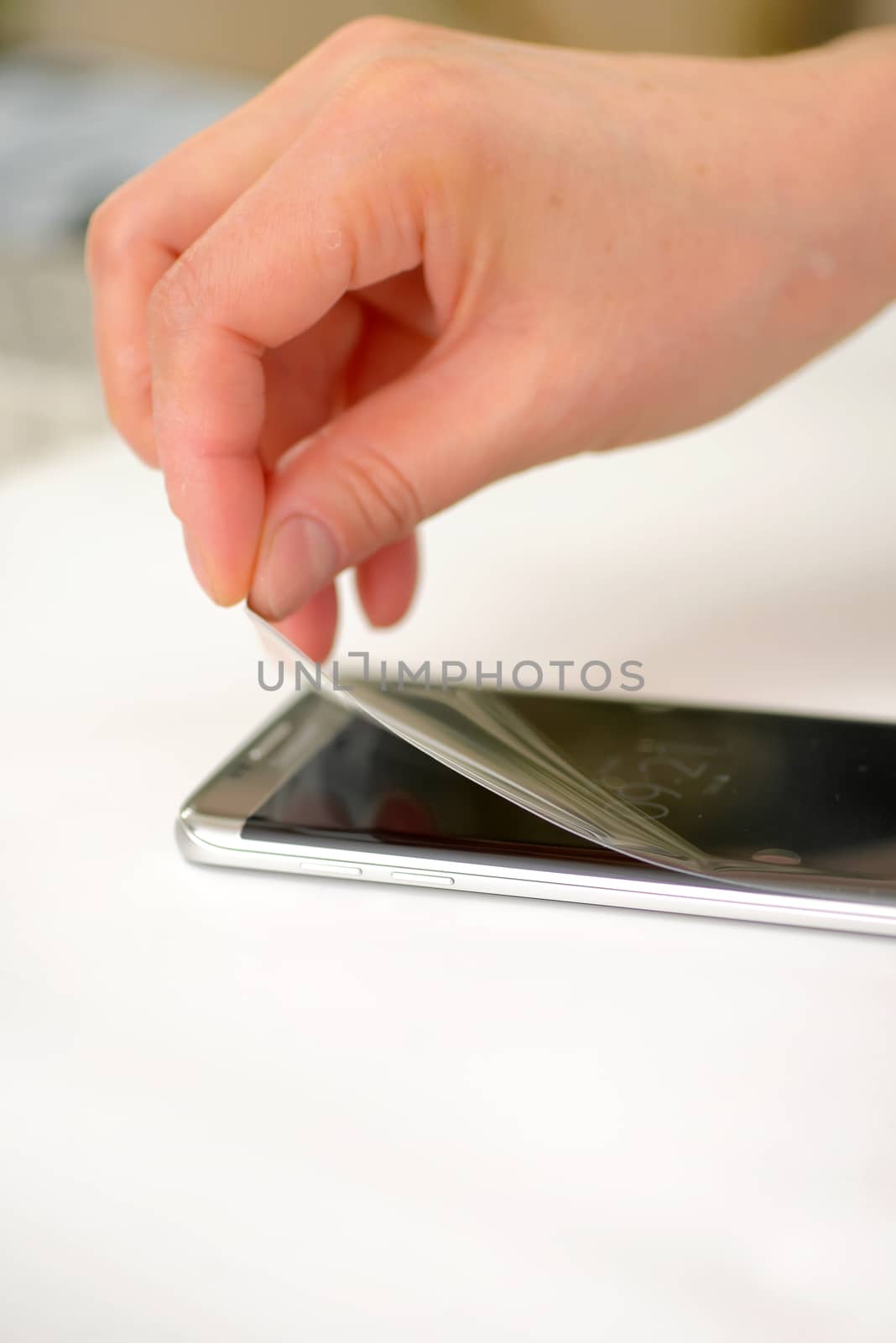 Applying screen protector on smartphone