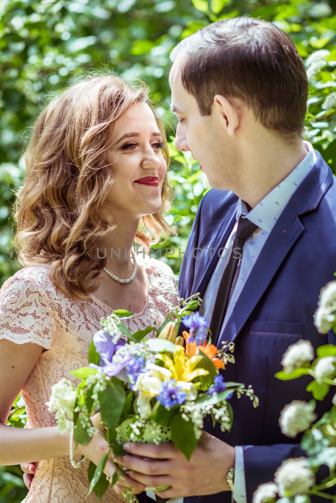 Close up portrait of couple. Smiling man and woman embracing in Lviv, Ukraine.