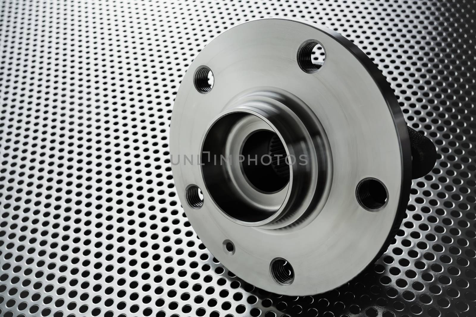 Composition of the car wheel bearing on metal surface. Selective focus