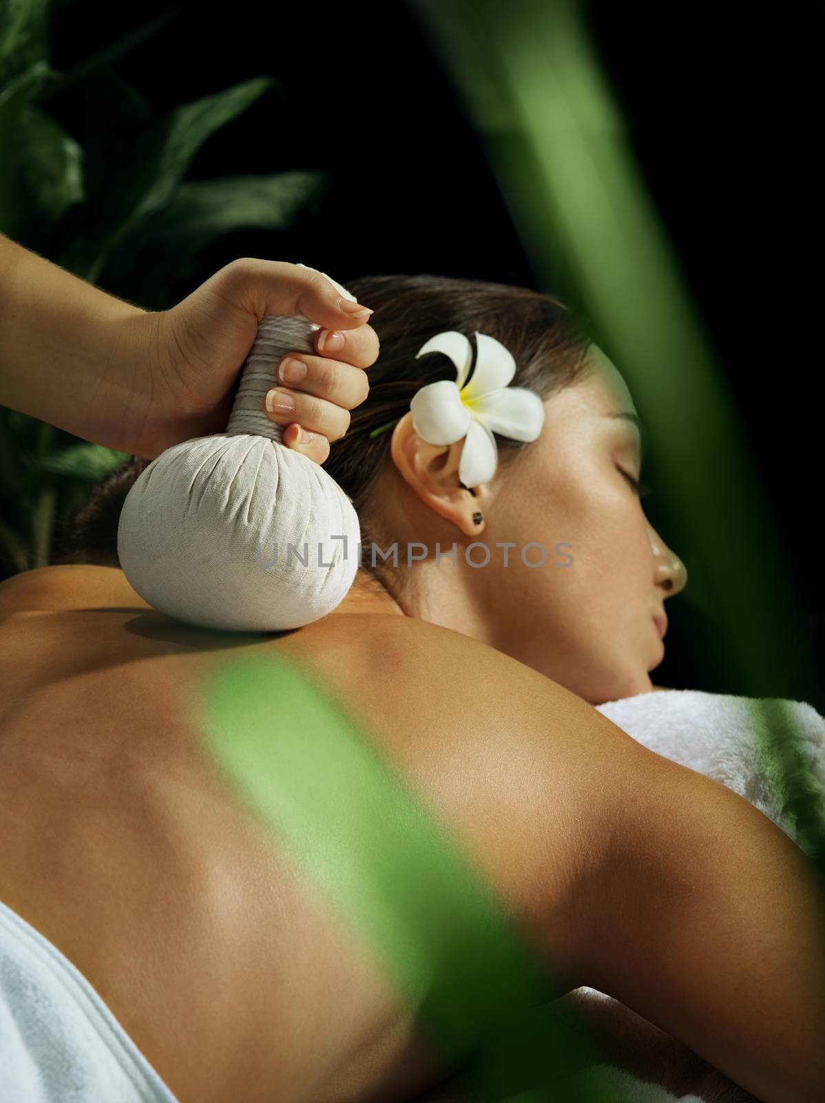 portrait of young beautiful woman in spa environment